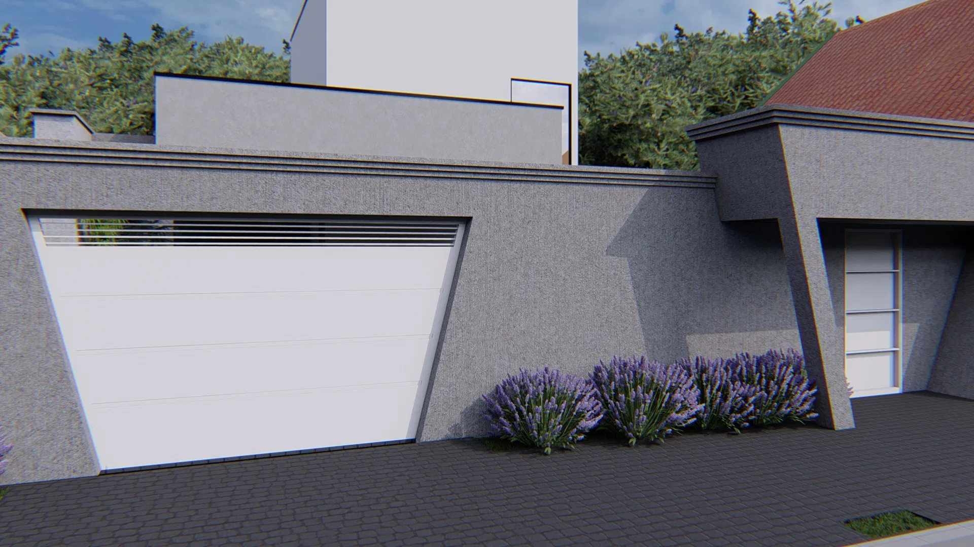 Close view of the garage with a white sectional door, gray textured facade and purple flowering shrubs at the base