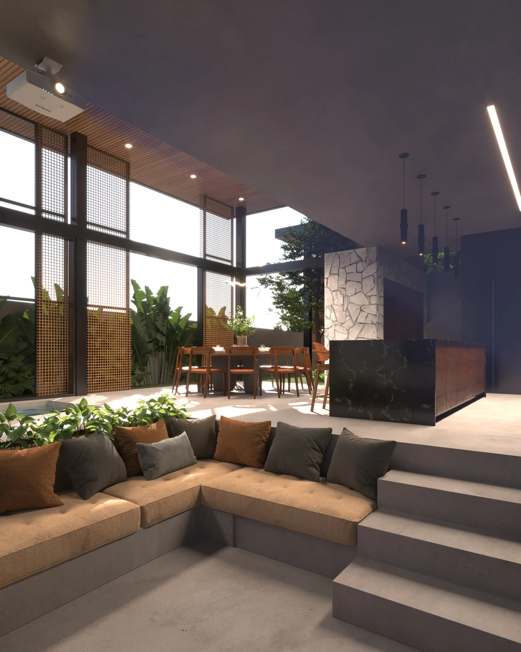 Sunken lounge with a corner sofa and cushions, steps up to a dark stone kitchen island and hanging pendant lights