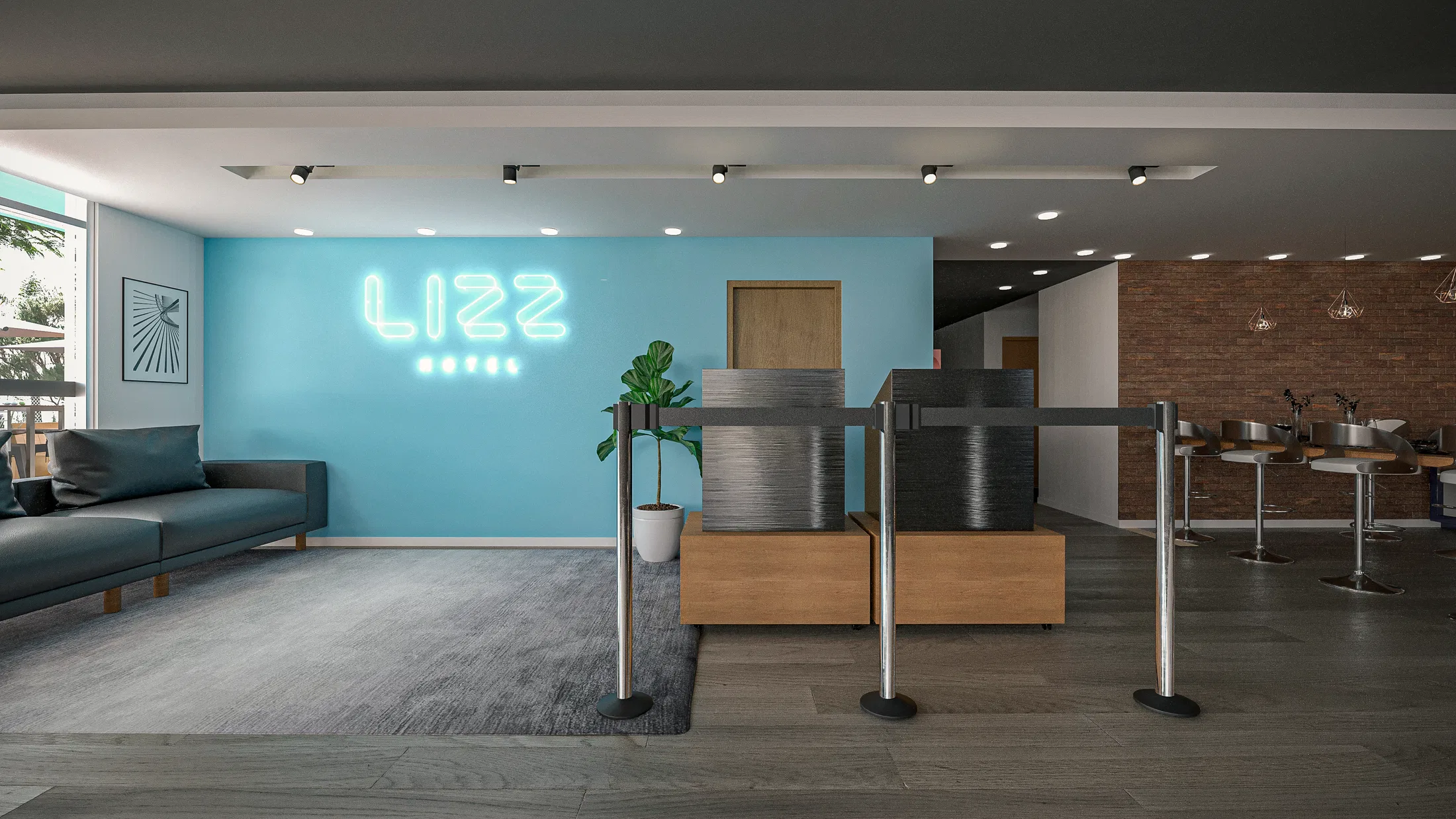 Reception with a turquoise wall and the hotel's neon sign, a green leather sofa, a textured desk and chrome queue posts beside a brick wall