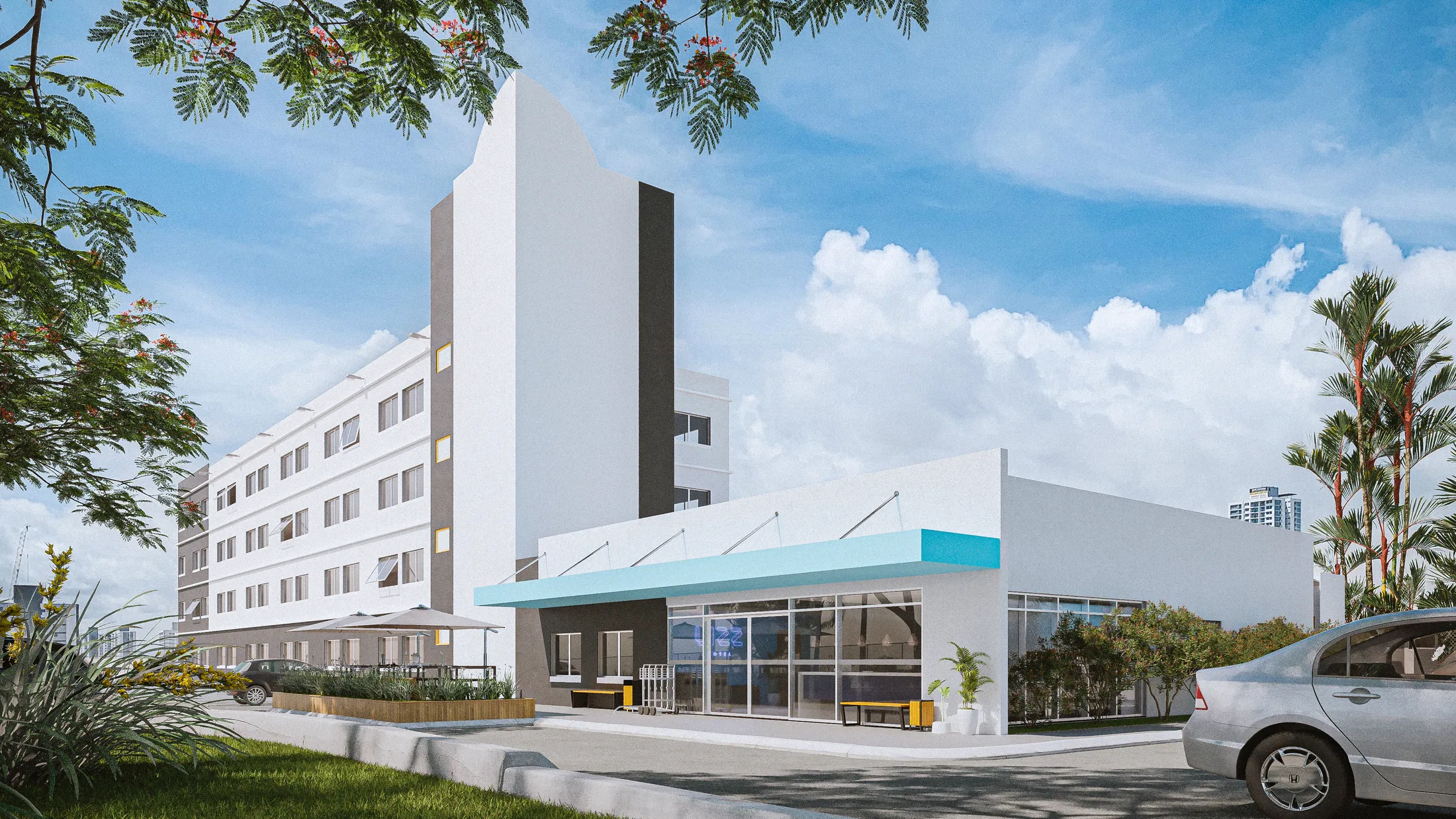 Multi-storey hotel facade with a single-storey café annex under a light-blue awning, framed by a flowering tree and palms on a clear day