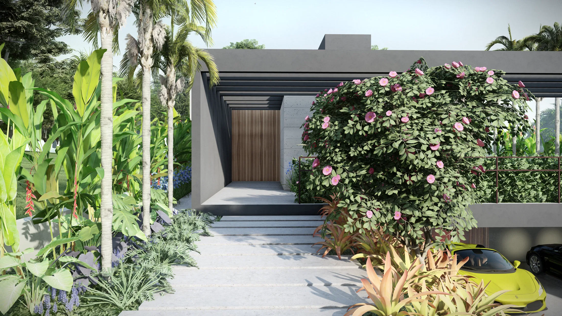 Entrance walkway framed by banana plants and palms, a wooden door set in a concrete niche and a flowering shrub in the foreground