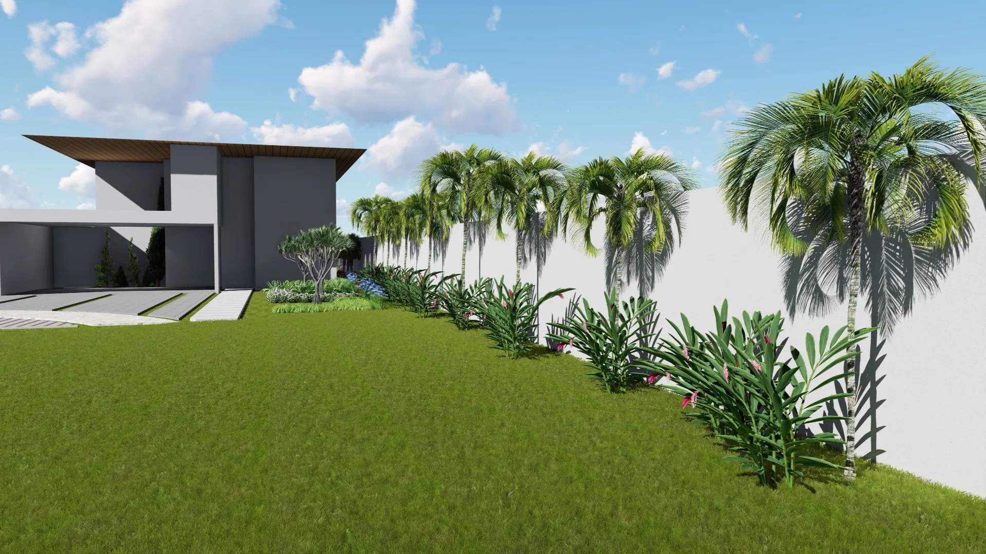 Modern two-storey house beside a lawn, with a lateral bed of palm trees and flowering shrubs running along the white boundary wall.
