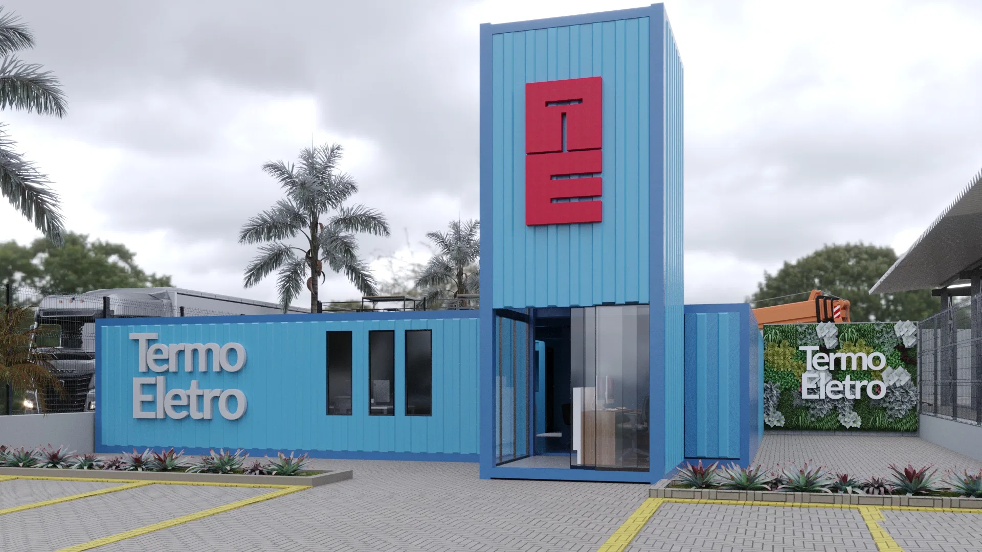 Access facade of blue containers with a central red-panel tower and monogram, raised 'Termo Eletro' lettering and a green panel on the right, over a marked parking lot