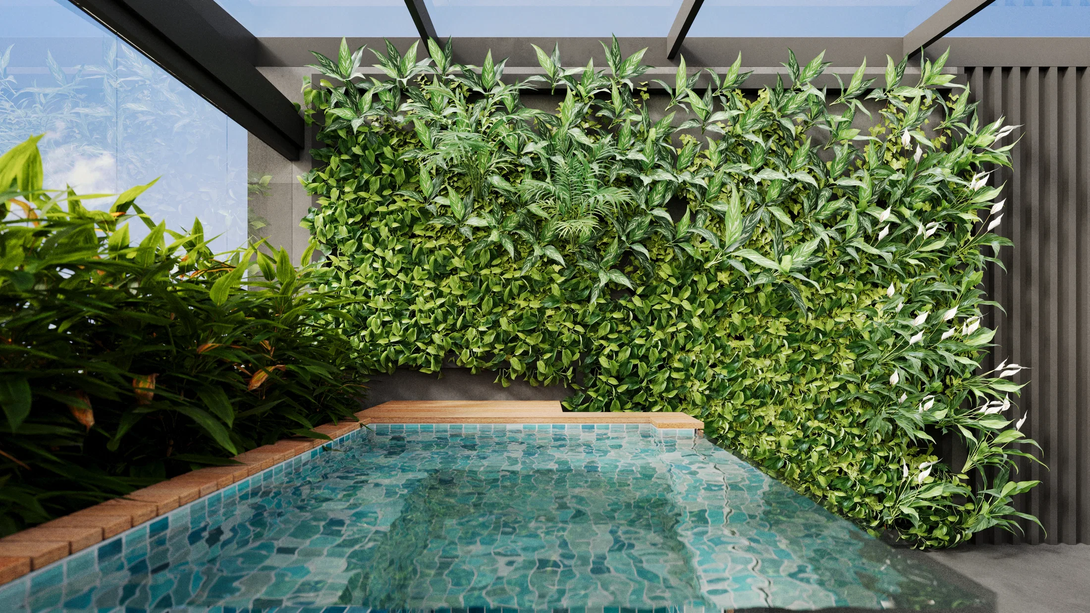 Green mosaic plunge pool set against a large living wall, with a wood deck and tropical foliage alongside.