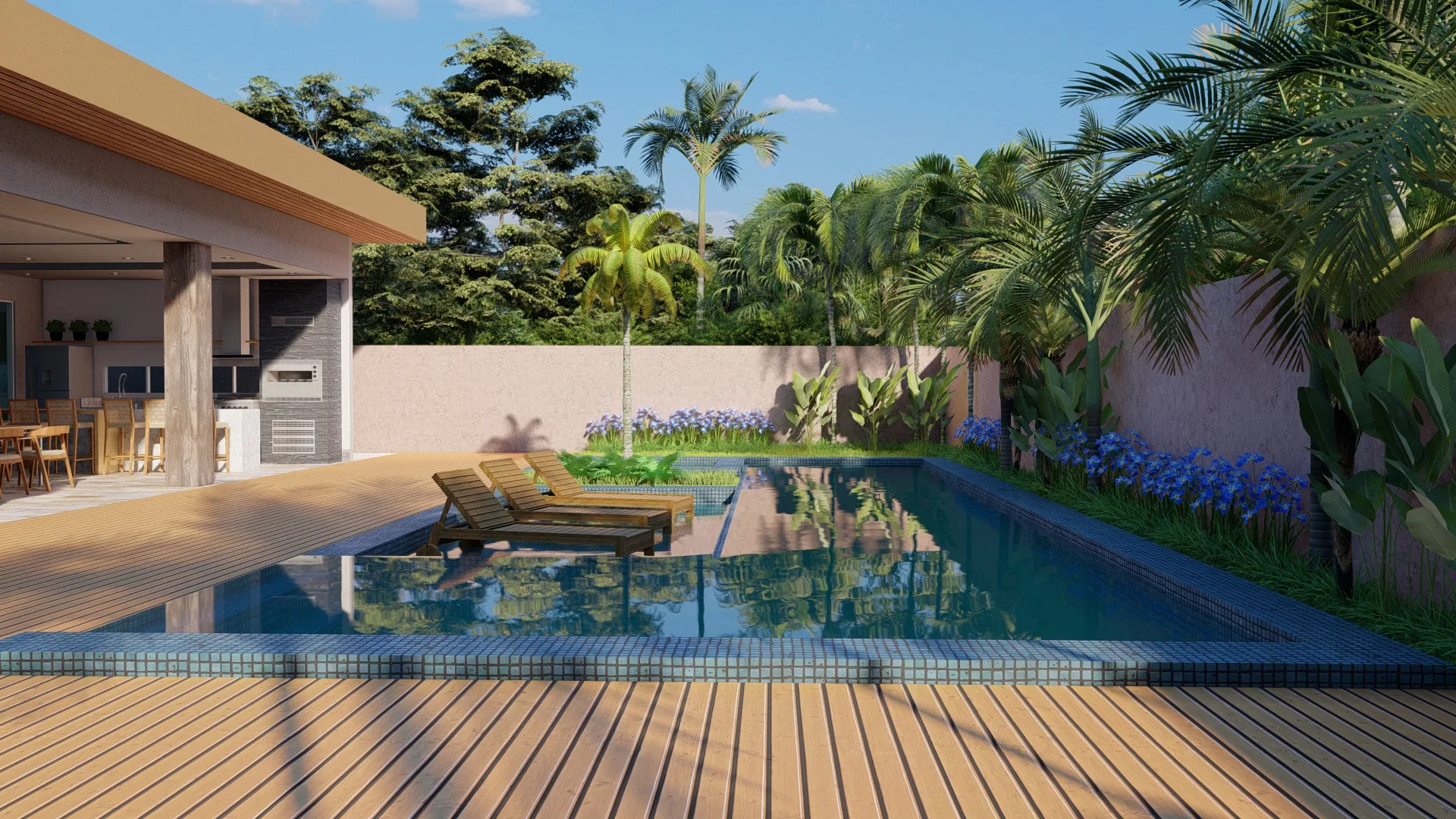 Pool area with a wooden deck and loungers, water reflecting palms and a covered gourmet space in the background.