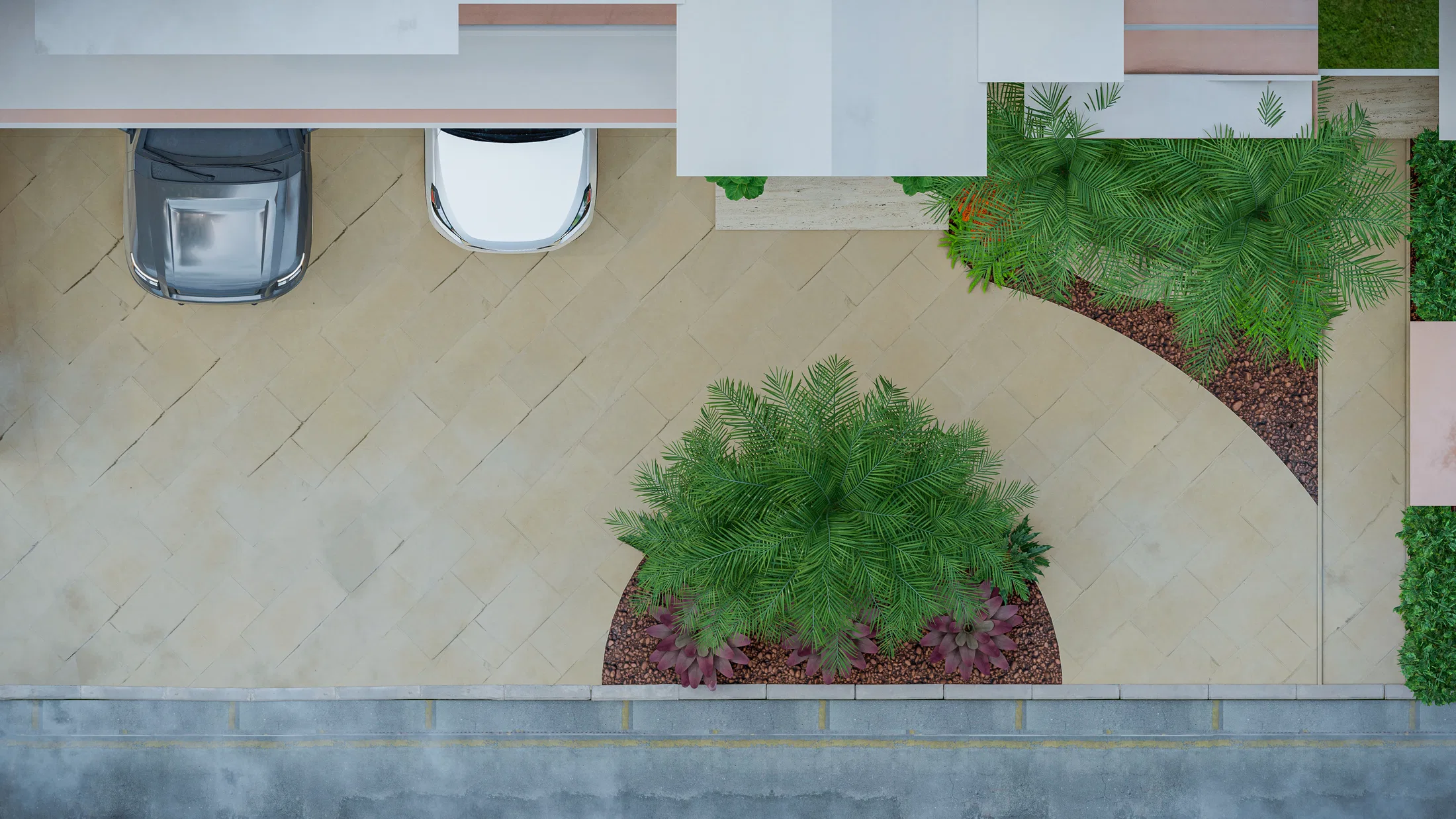 Aerial view of an access planting bed with young palms, pruned shrubs and paved carport spaces