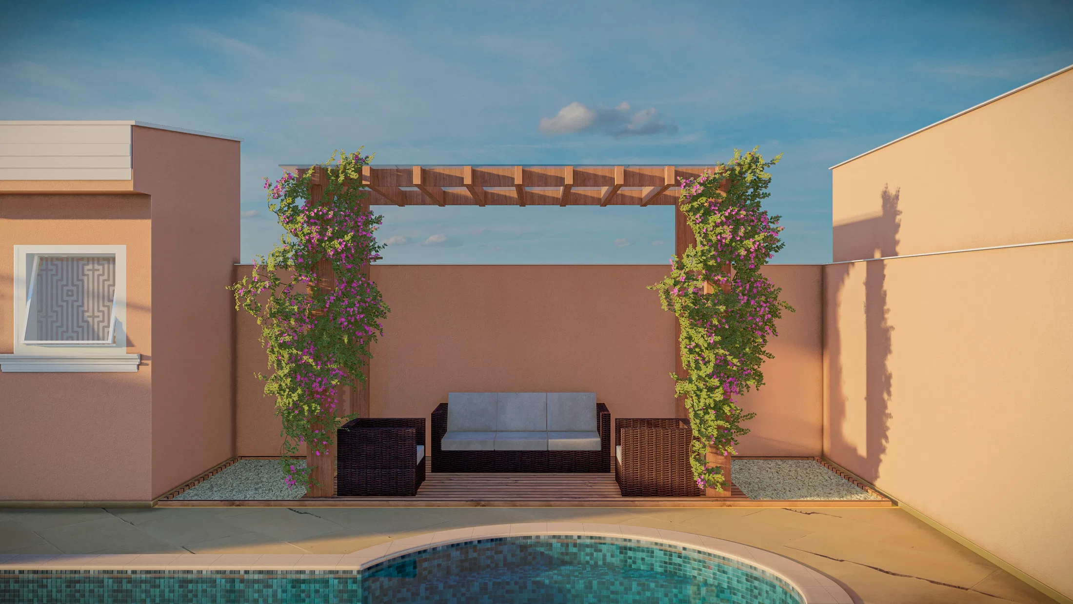 Seating area with a sofa under a pergola covered in flowering vines, next to a pool edge