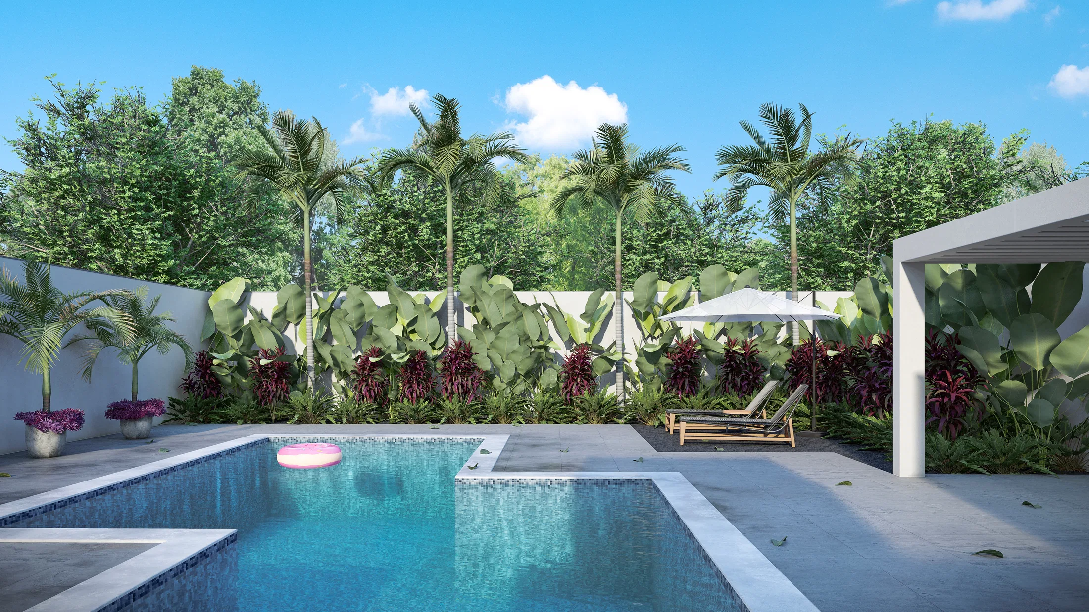 Another angle of the pool with loungers, a sun umbrella and dense tropical planting in the background
