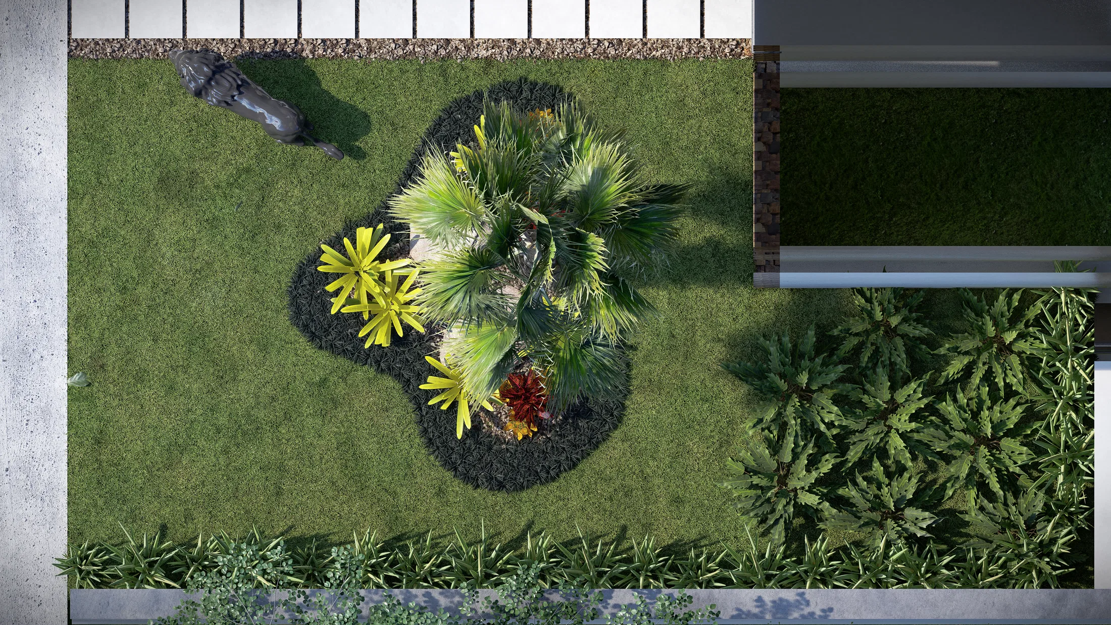 Overhead view of the tropical planting bed next to the stone pathway, with the lion sculpture nearby