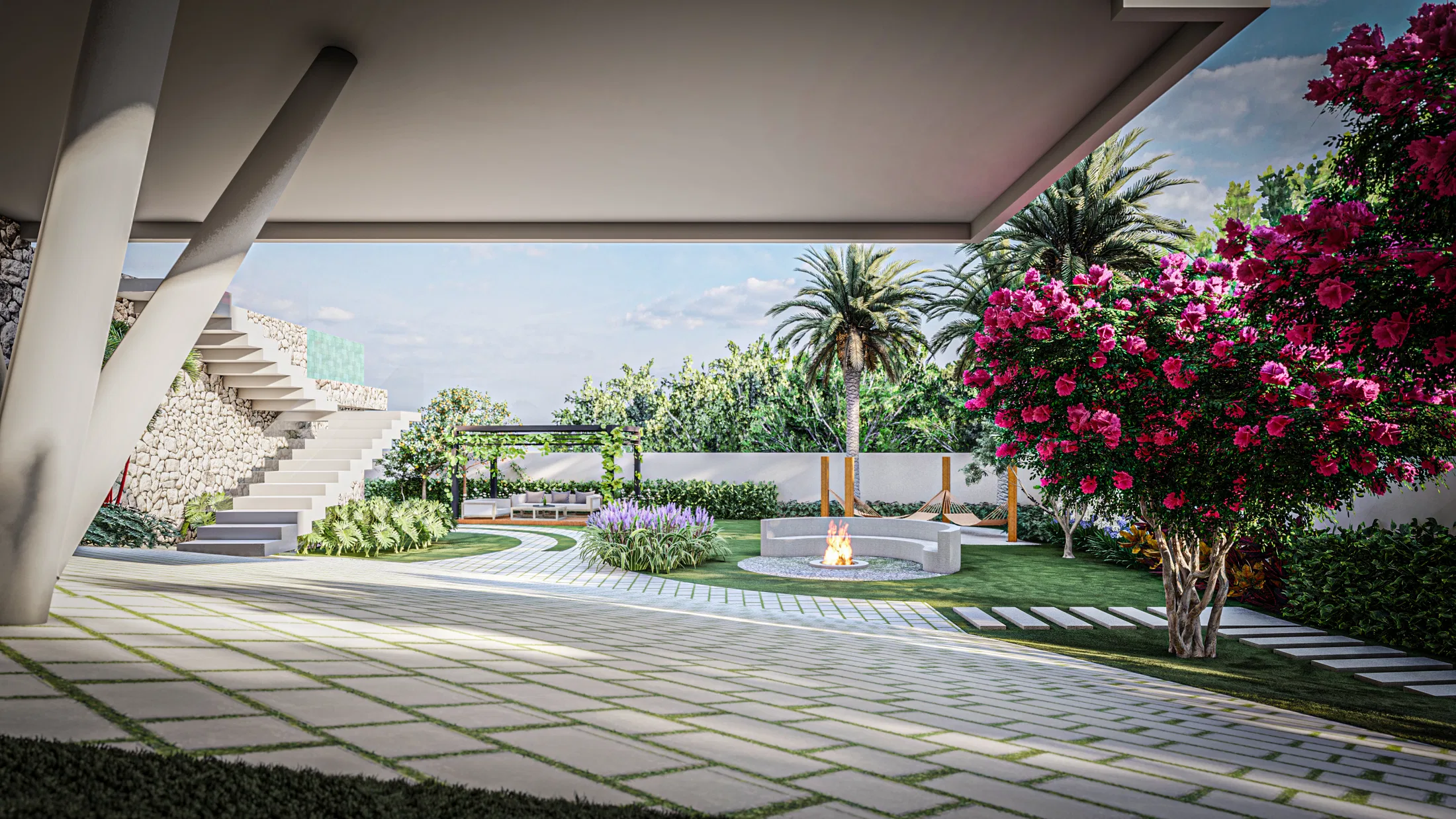 Covered patio facing a circular fire pit in the garden, with a palm, blooming magenta bougainvillea and a mass of lilac flowers.