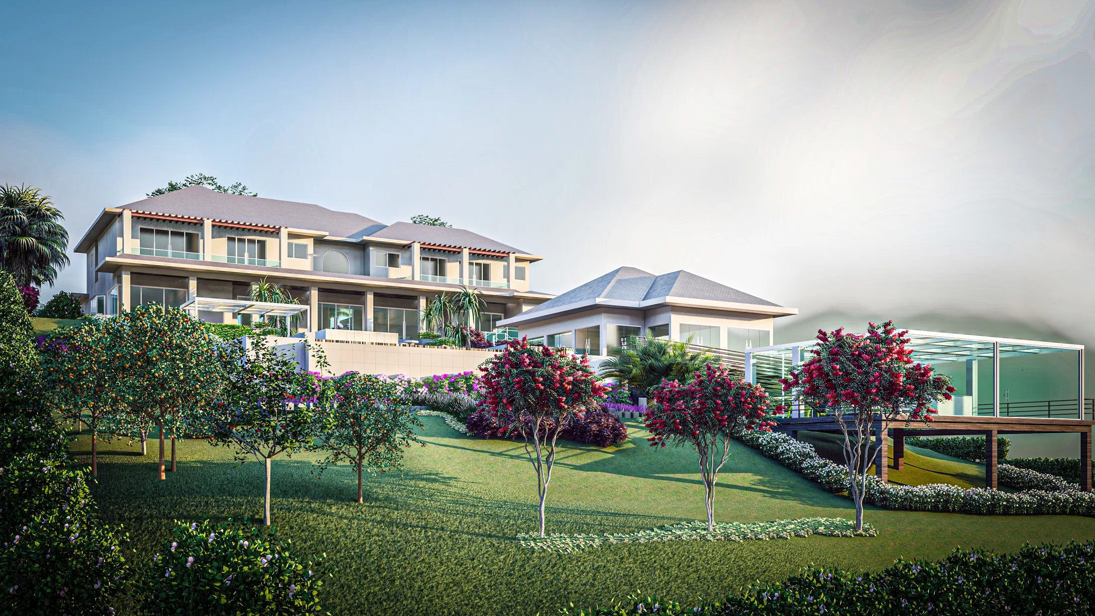 View of the hillside residence from the lawn below, with rows of young red-flowering trees and hedges shaping the slope