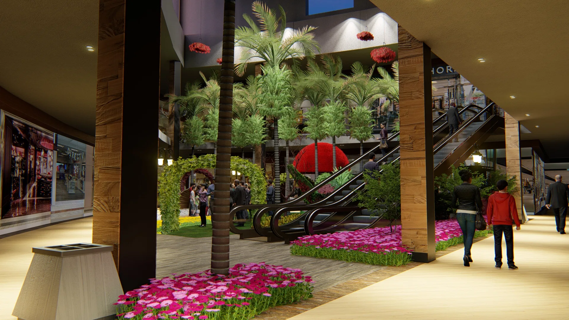 Mall ground level with a tall palm in a magenta flower bed, escalators beyond and red pendant ornaments hanging from the ceiling