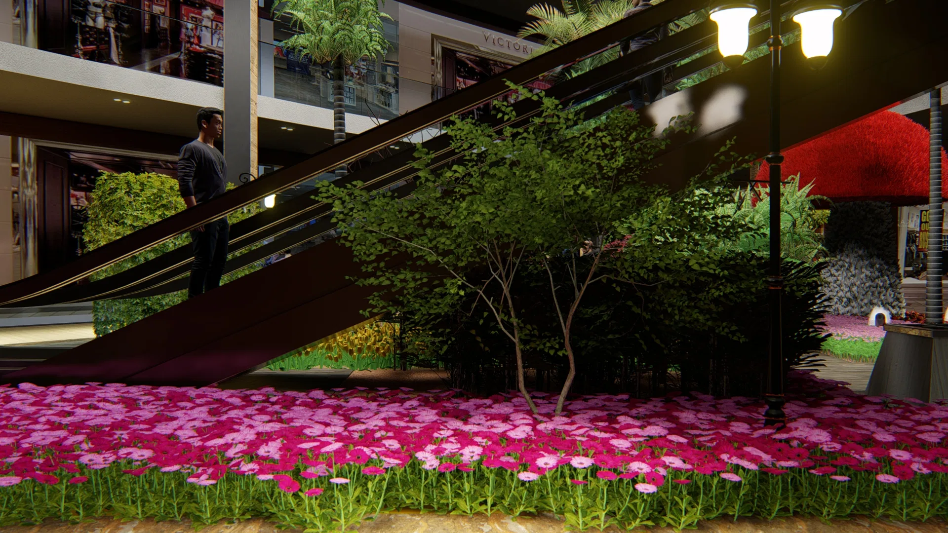 Dense carpet of magenta daisies beneath the escalators, with a small ornamental tree, a classic black lamppost and lit storefronts behind