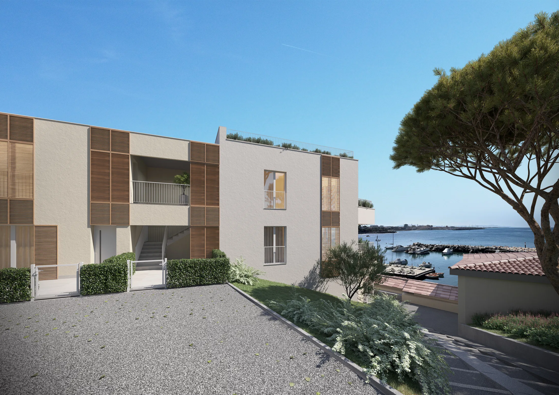 Residential block with wood-slat screens and an external stair beside a gravel courtyard, moored boats in the marina behind