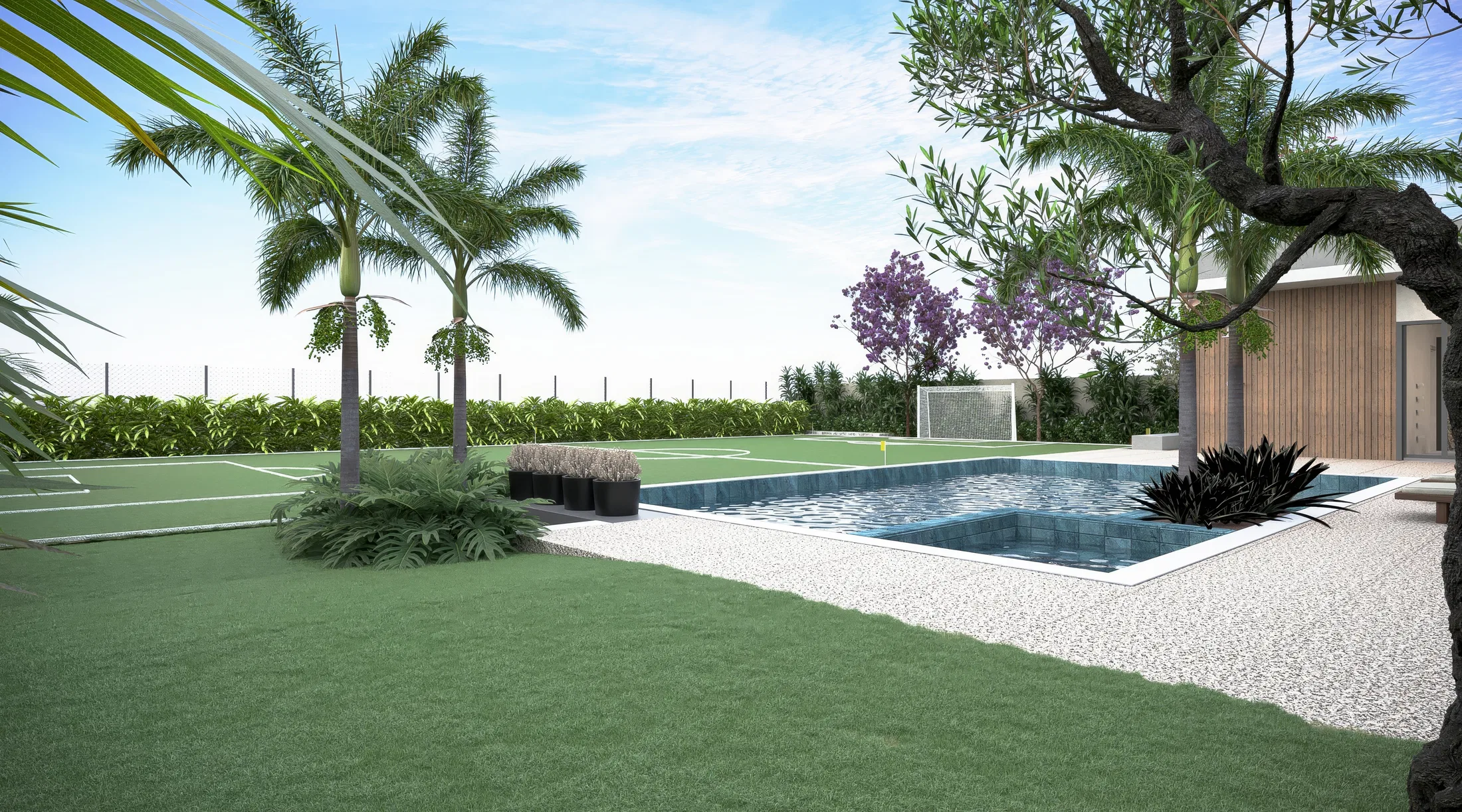 Backyard with a blue-tiled pool and pebble deck, an artificial-grass sports court, palms and a flowering jacaranda behind