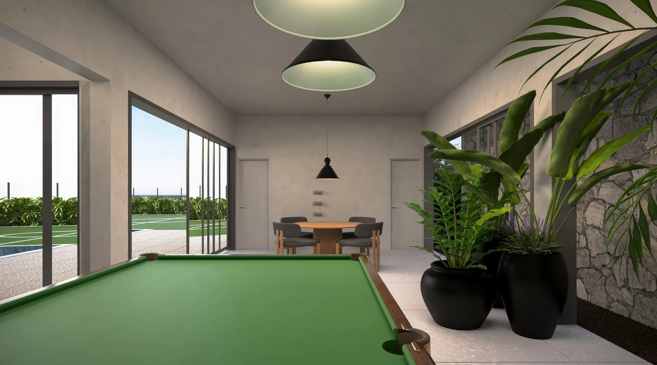 Games room with a green-felt billiards table, black conical pendants, glass doors to the garden and a stone wall with planters