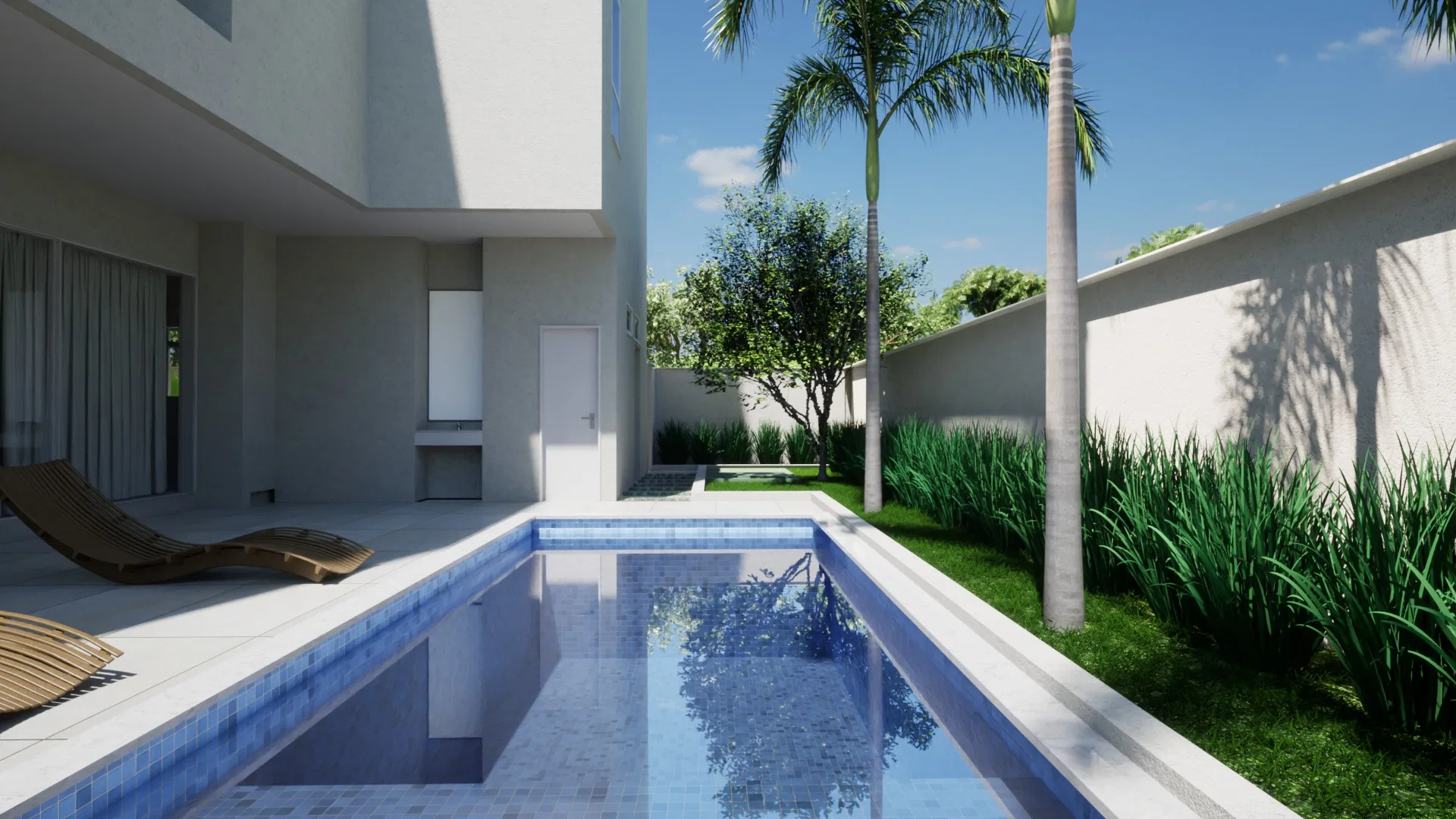 Poolside deck against the house, with a wooden lounger, palm trunks and a strip of grasses at the base of the wall