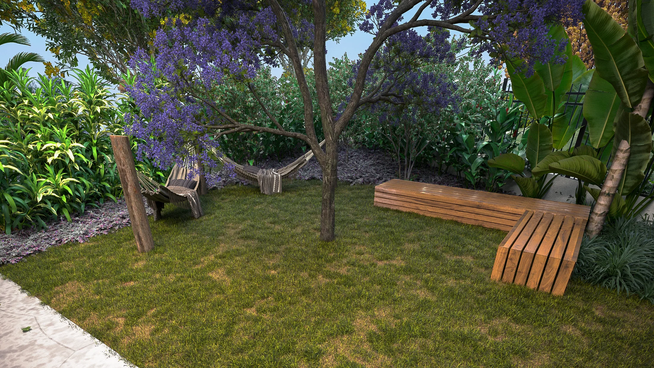 Lawn shaded by a lilac-flowering tree, with a hammock between posts and a long timber bench, ringed by dracaenas and banana plants