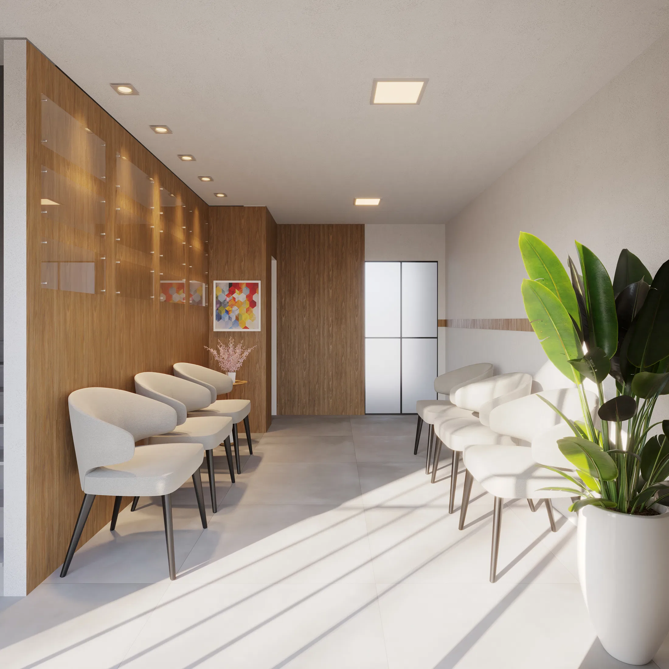 Waiting area with light-gray upholstered chairs lined against a wood wall, a colorful framed artwork and a potted plant in the background
