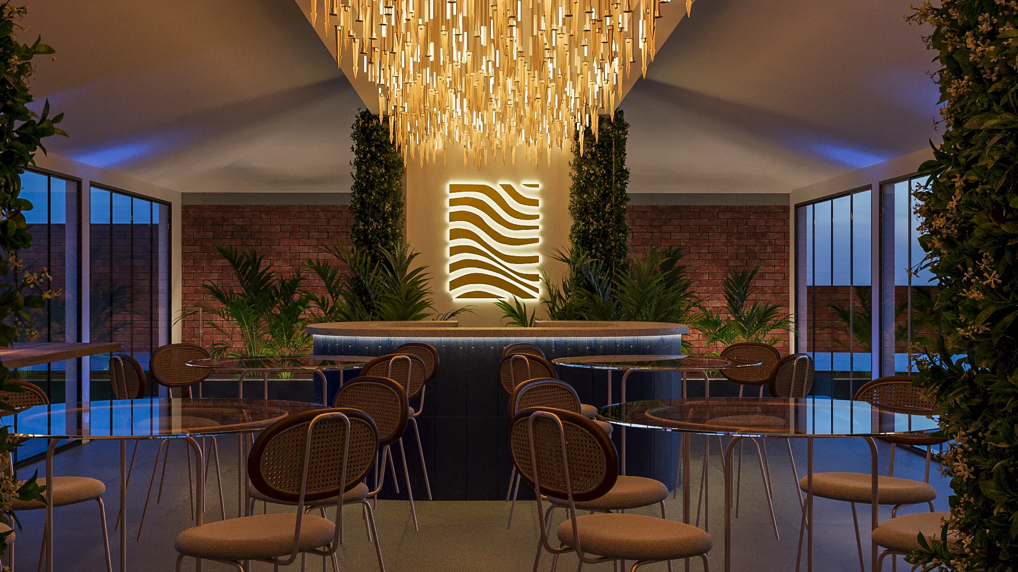 Curved central bar beneath a cascading golden chandelier, a backlit wavy panel, a brick wall and glass tables with cane-back chairs