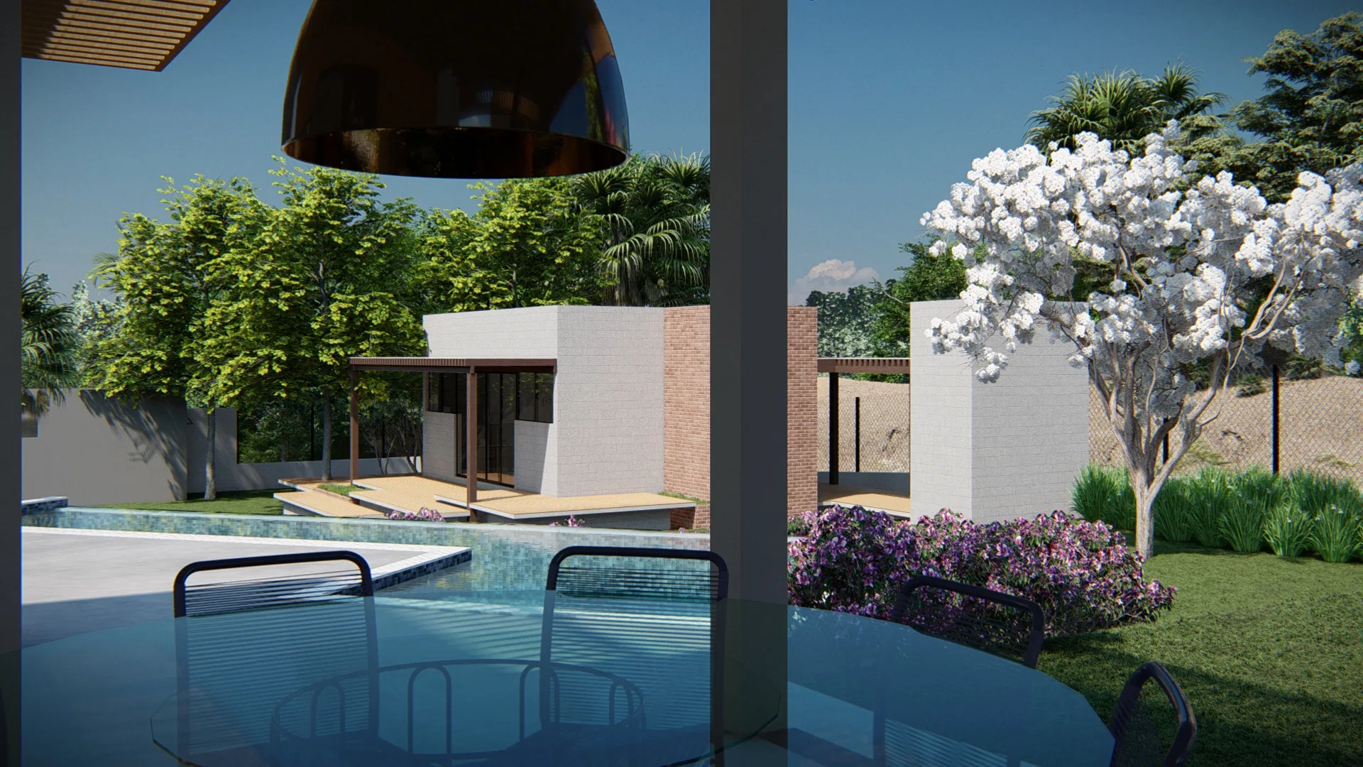 Covered lounge with wooden pergola and a copper pendant lamp, overlooking an infinity pool and a flowering tree at the back of the garden
