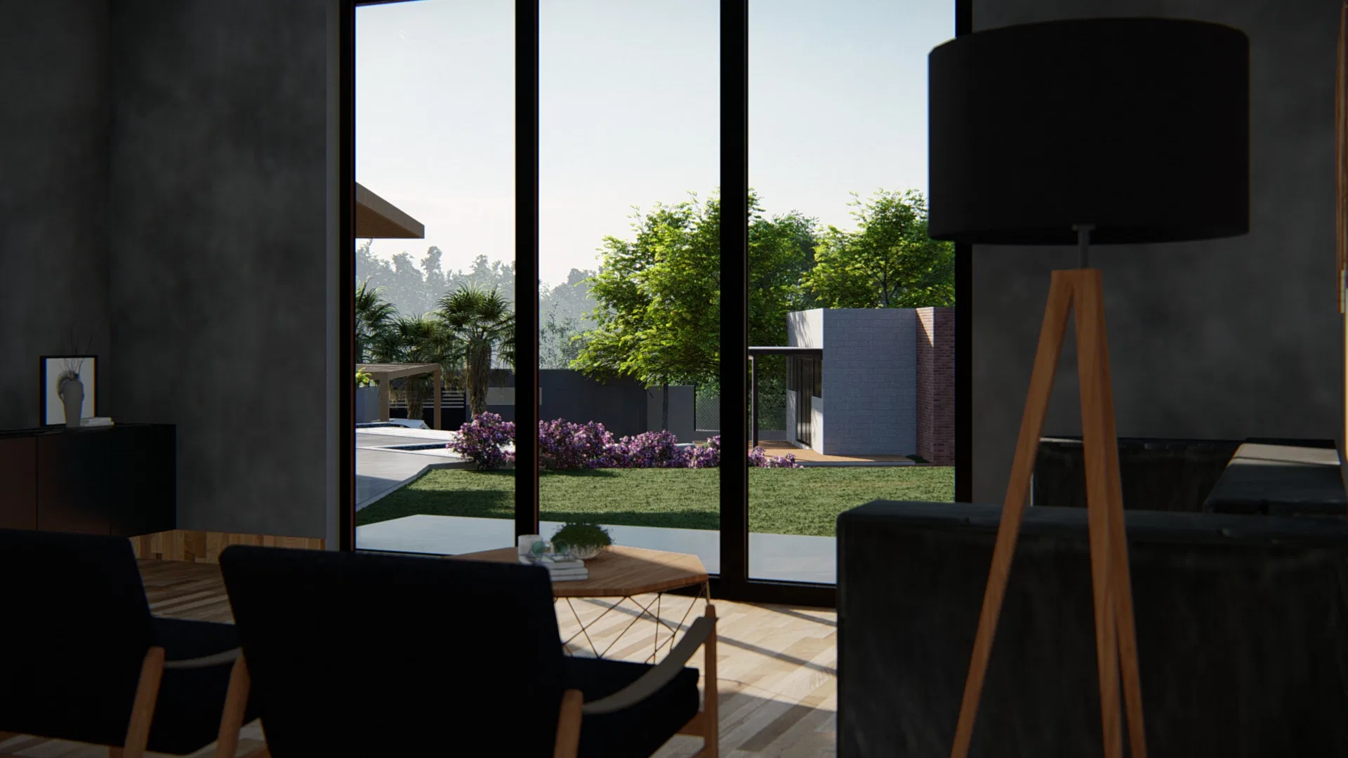 Living room with dark armchairs and wide glass doors facing the lawn garden and white facade beyond