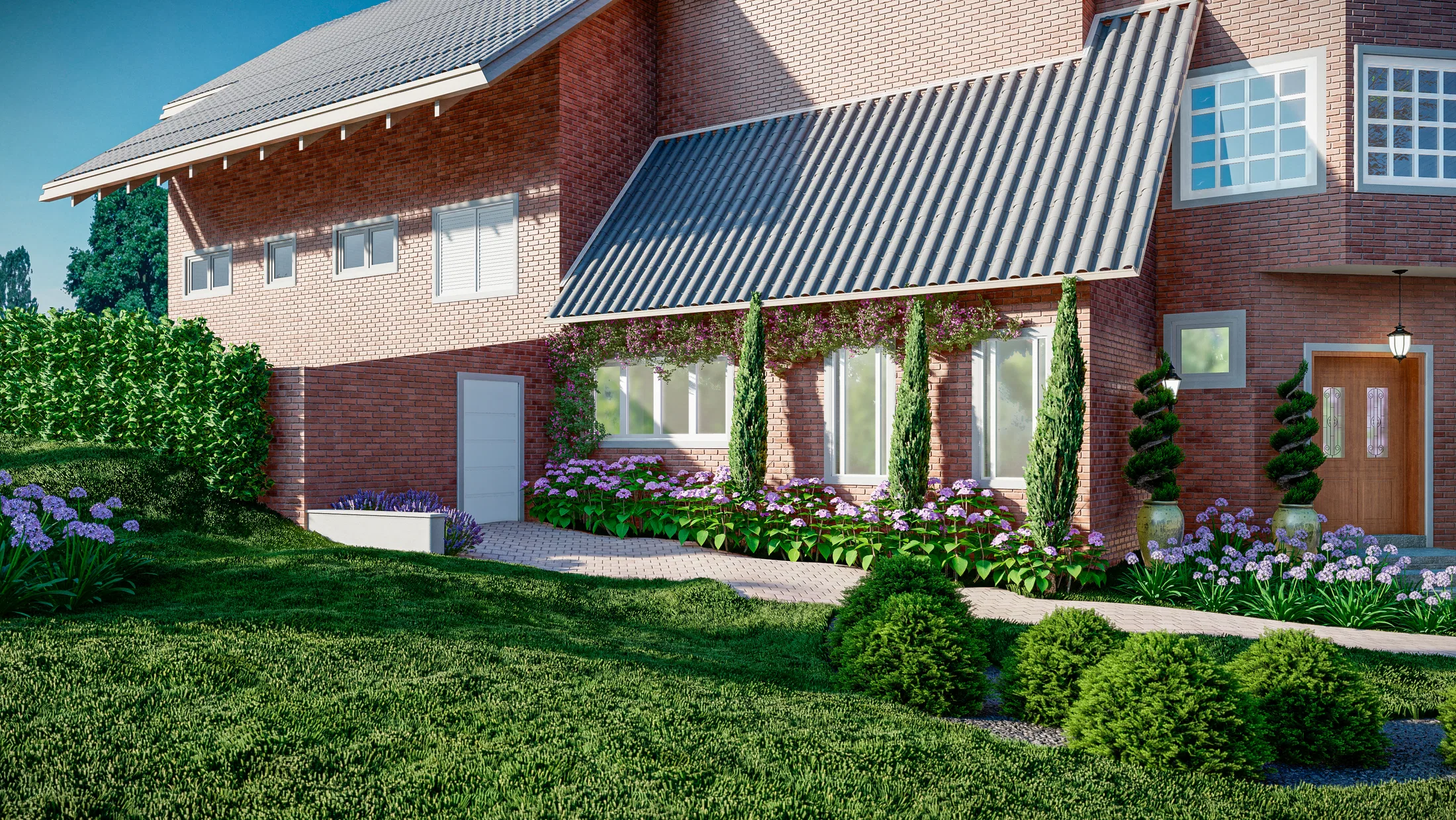 Side of the brick house with a metal awning and climbers, a bed of hydrangeas and agapanthus beneath the windows and conical topiary over the lawn