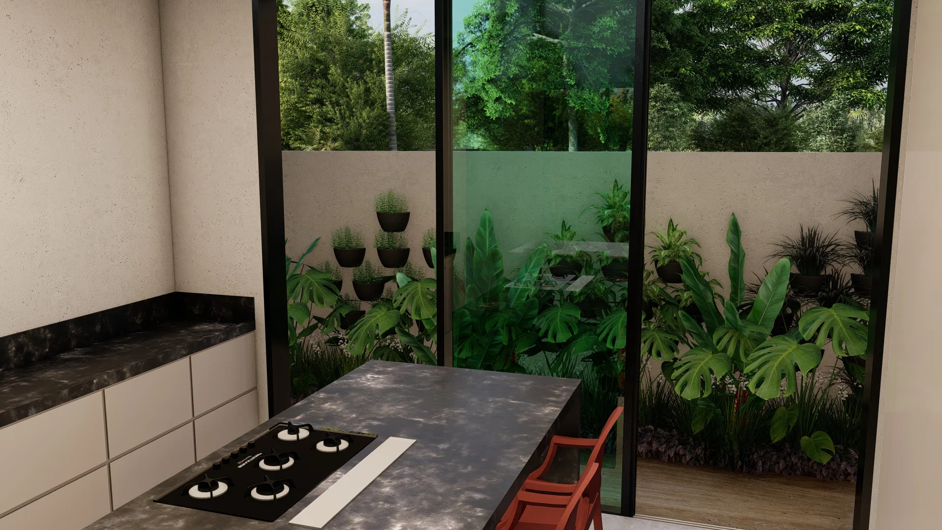 Kitchen with a dark-stone island and cooktop, a red chair and a glass wall framing a garden of potted grasses, monsteras and tropical foliage