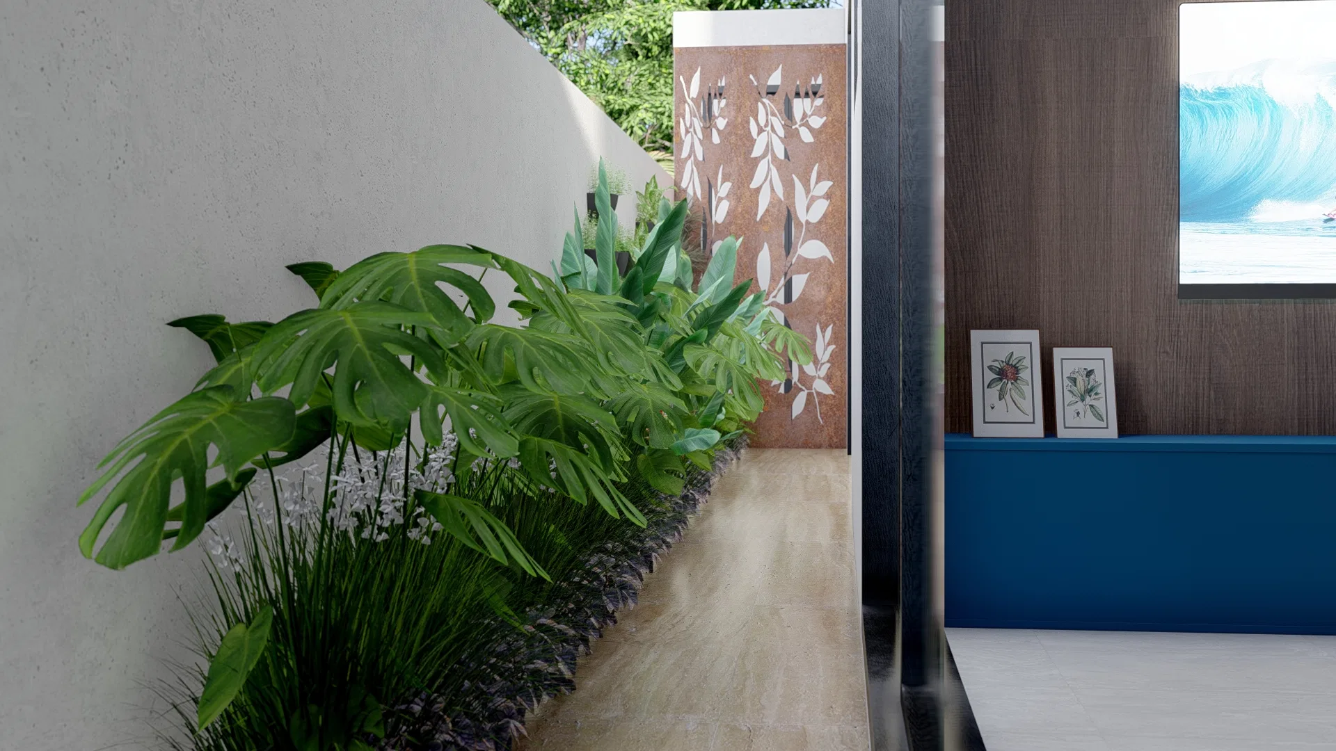 Interior space with a bed of monsteras, foliage and white flowers over stones, beside a leaf-cutout panel and a timber wall with framed prints