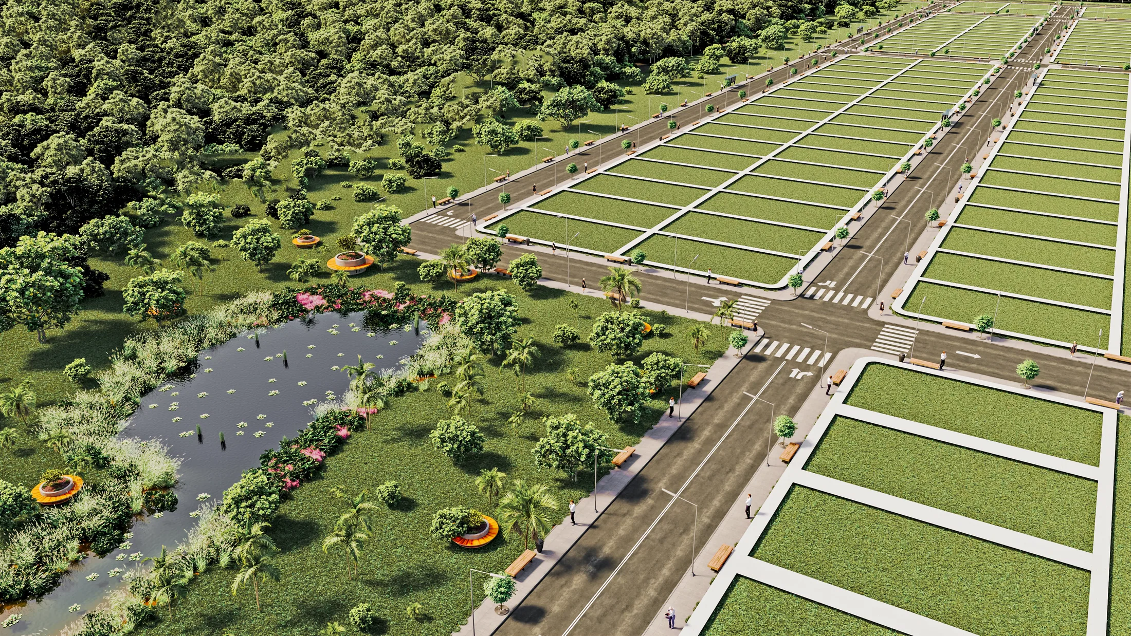 Aerial view with the lot blocks on the right and a green area on the left, a natural pond, flowering beds and palms by the boulevard