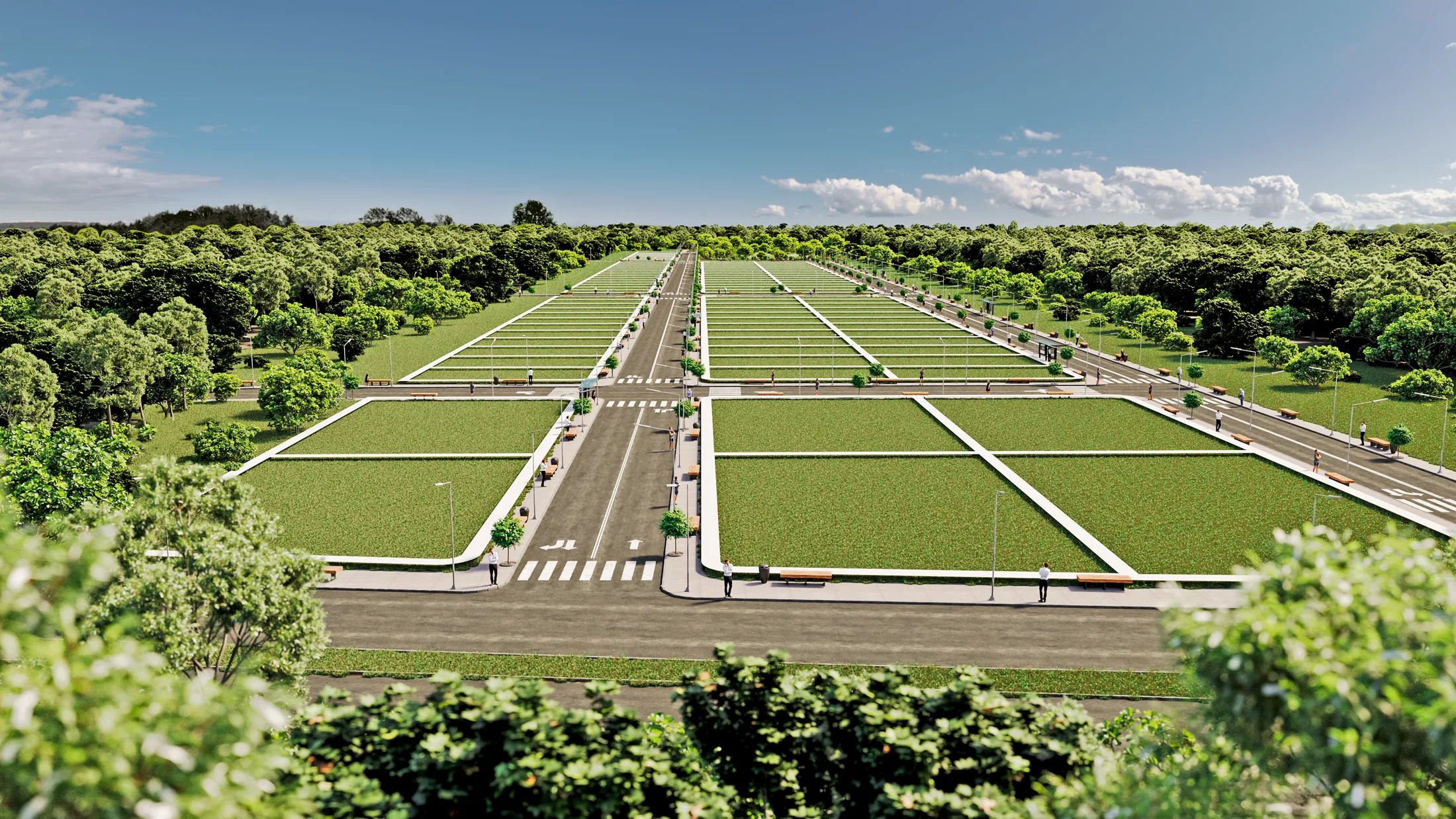 Elevated view of a land development with grassy lot blocks split by paved avenues, crosswalks and surrounding woodland