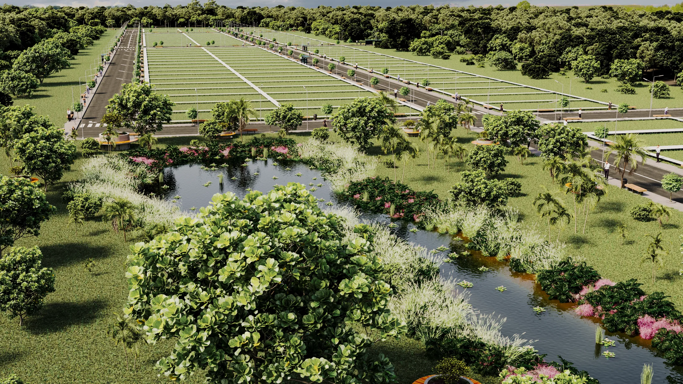 Naturalized pond in the foreground with aquatic plants and pink blooms, the lot blocks and avenues beyond among trees