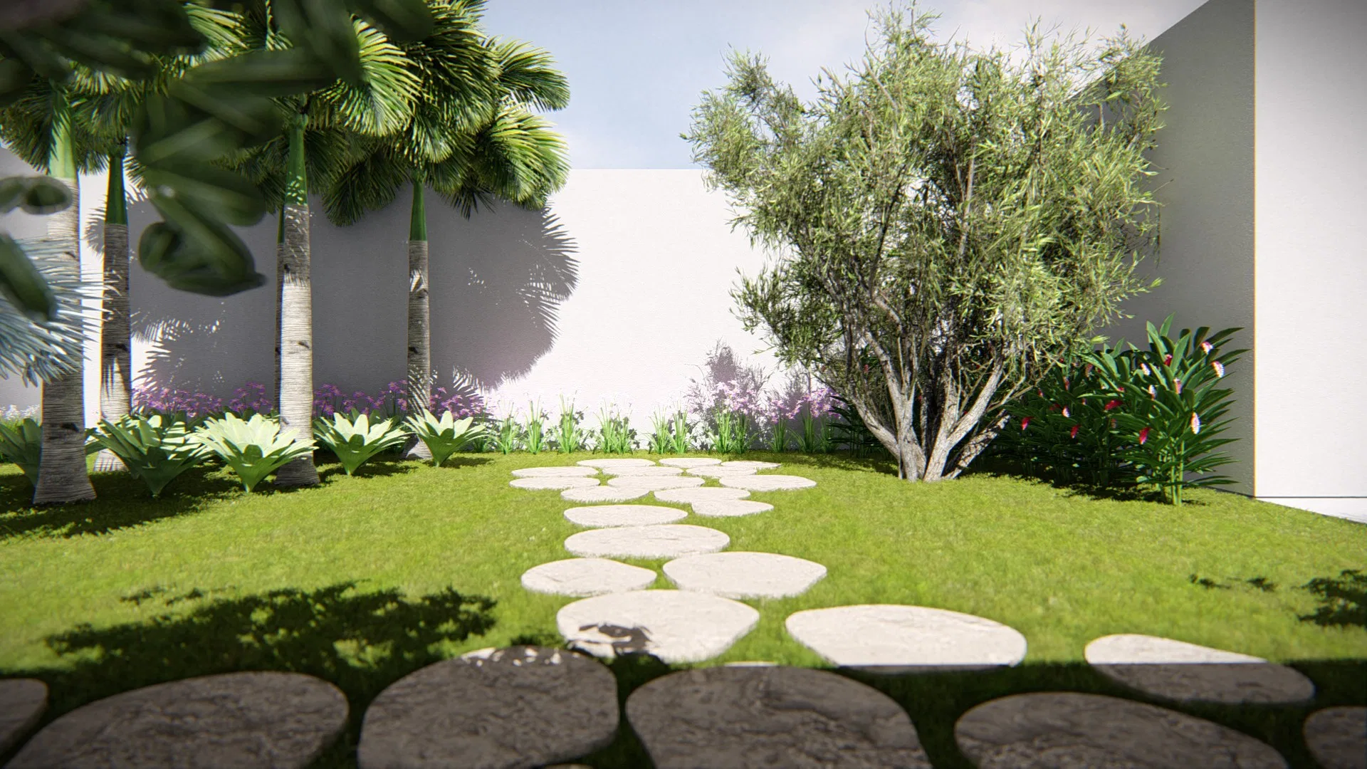 Another part of the garden with irregular stones on the lawn, green-trunked palms, a leafy tree and a bed of lilac flowers
