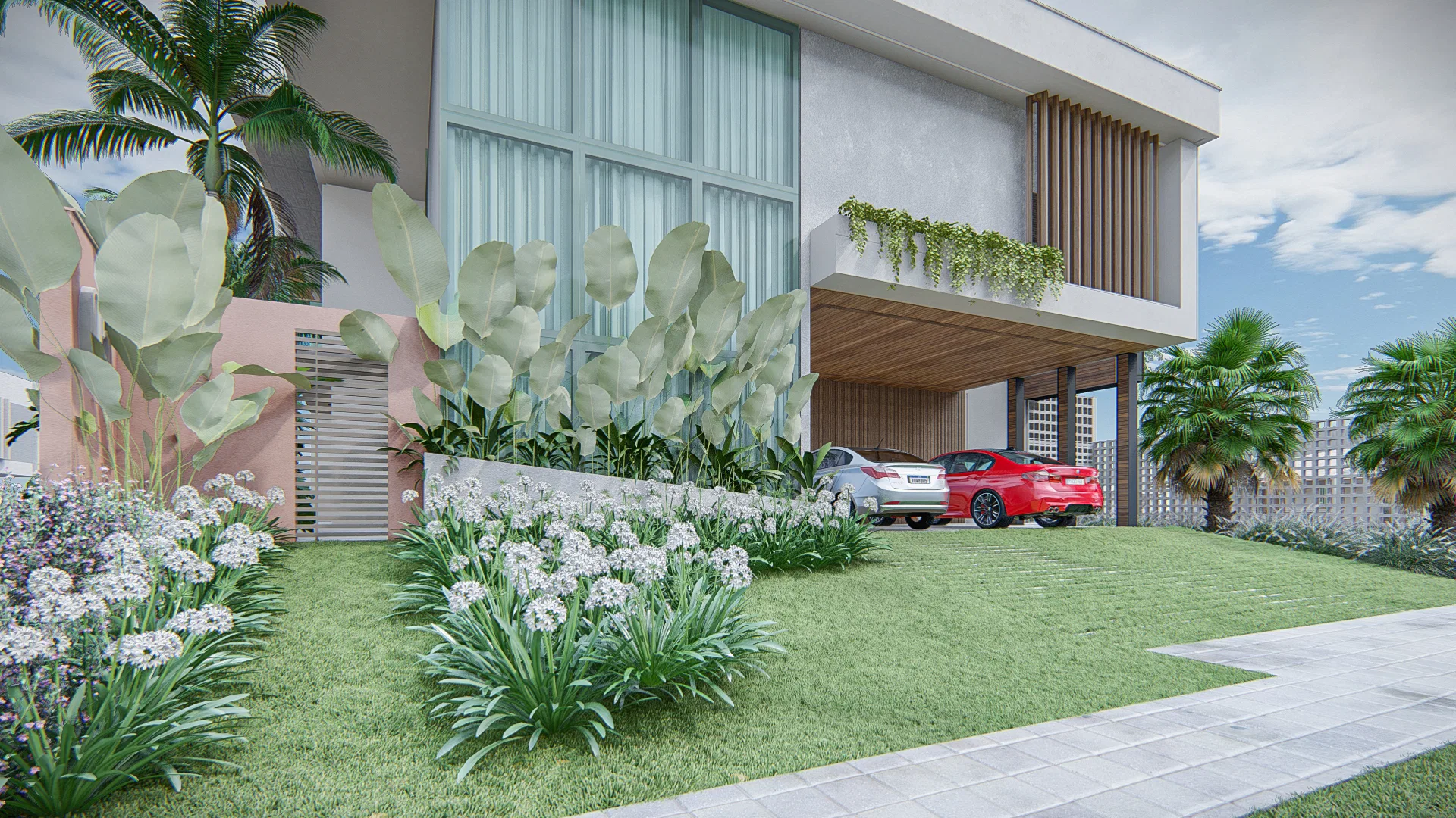 Closer view of the entrance with large-leaf planting against the facade and a two-car garage in the background