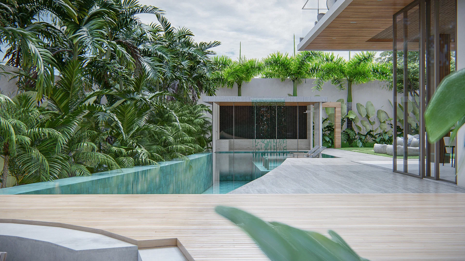 Infinity-edge pool with a stone water wall, surrounded by palm trees and timber decking in the foreground