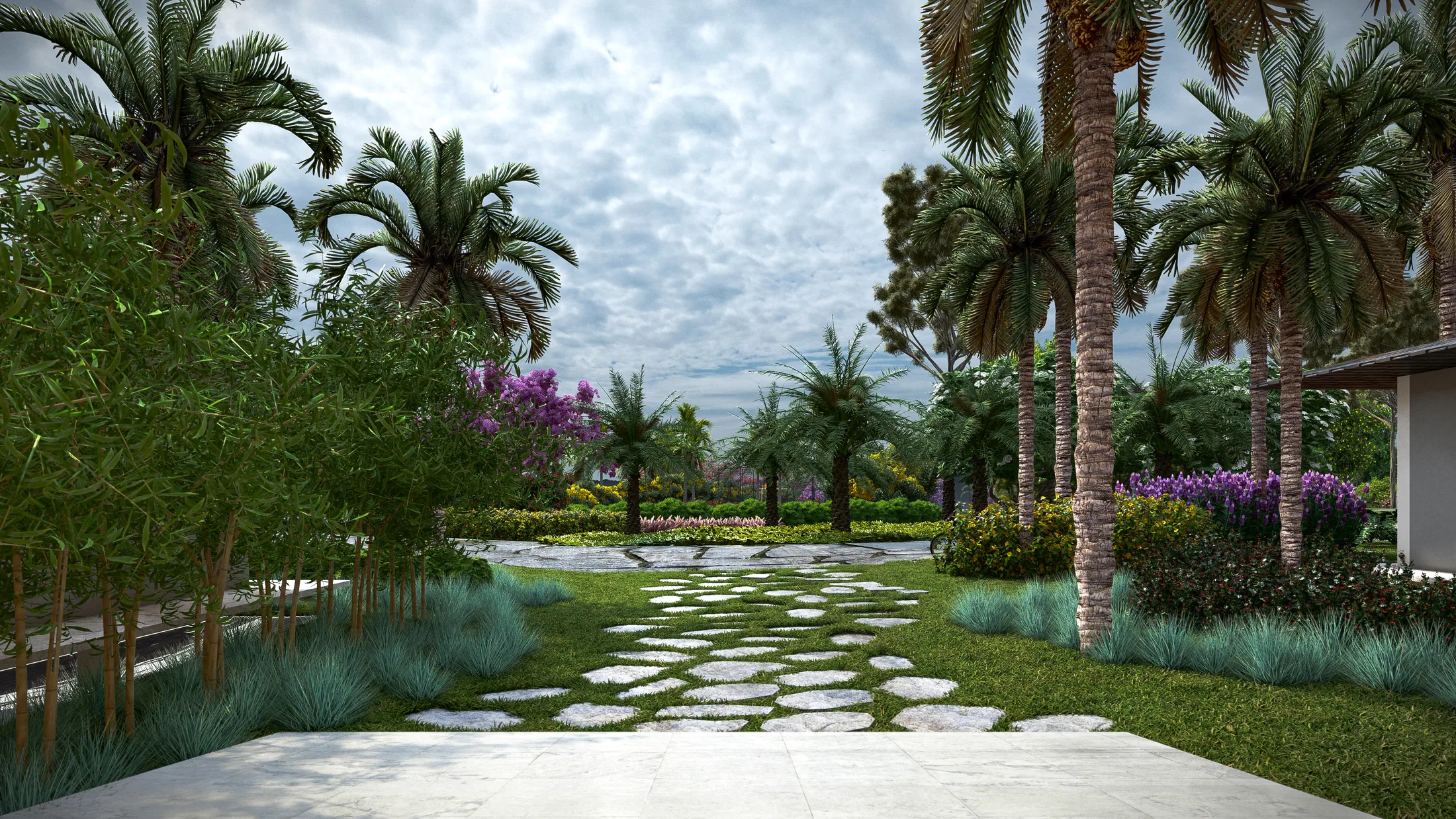 Irregular stone path between imperial palms and blue ornamental grasses, with a purple-flowering tree in the background under a cloudy sky