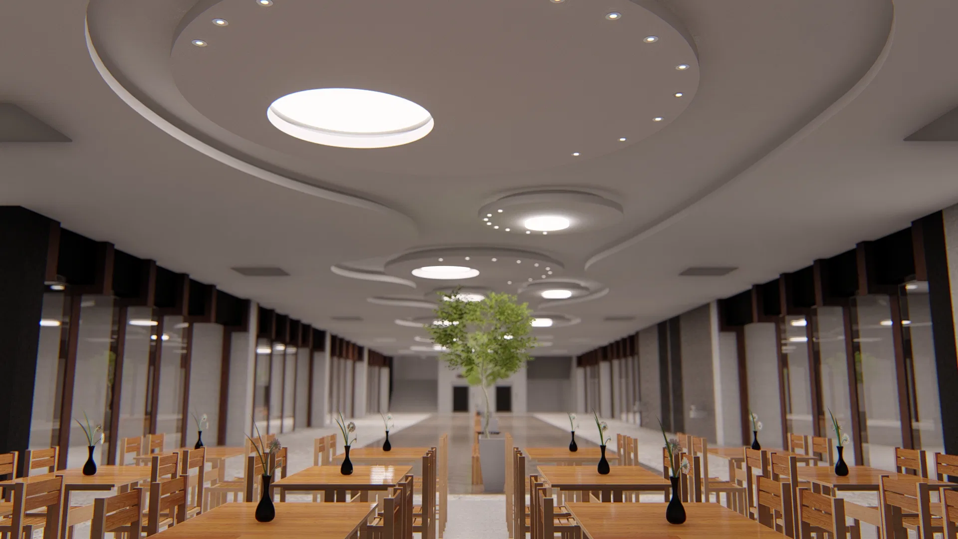 Perspective along the hall's wooden tables, with dark vases, an illuminated circular ceiling and a central tree marking the room's axis.