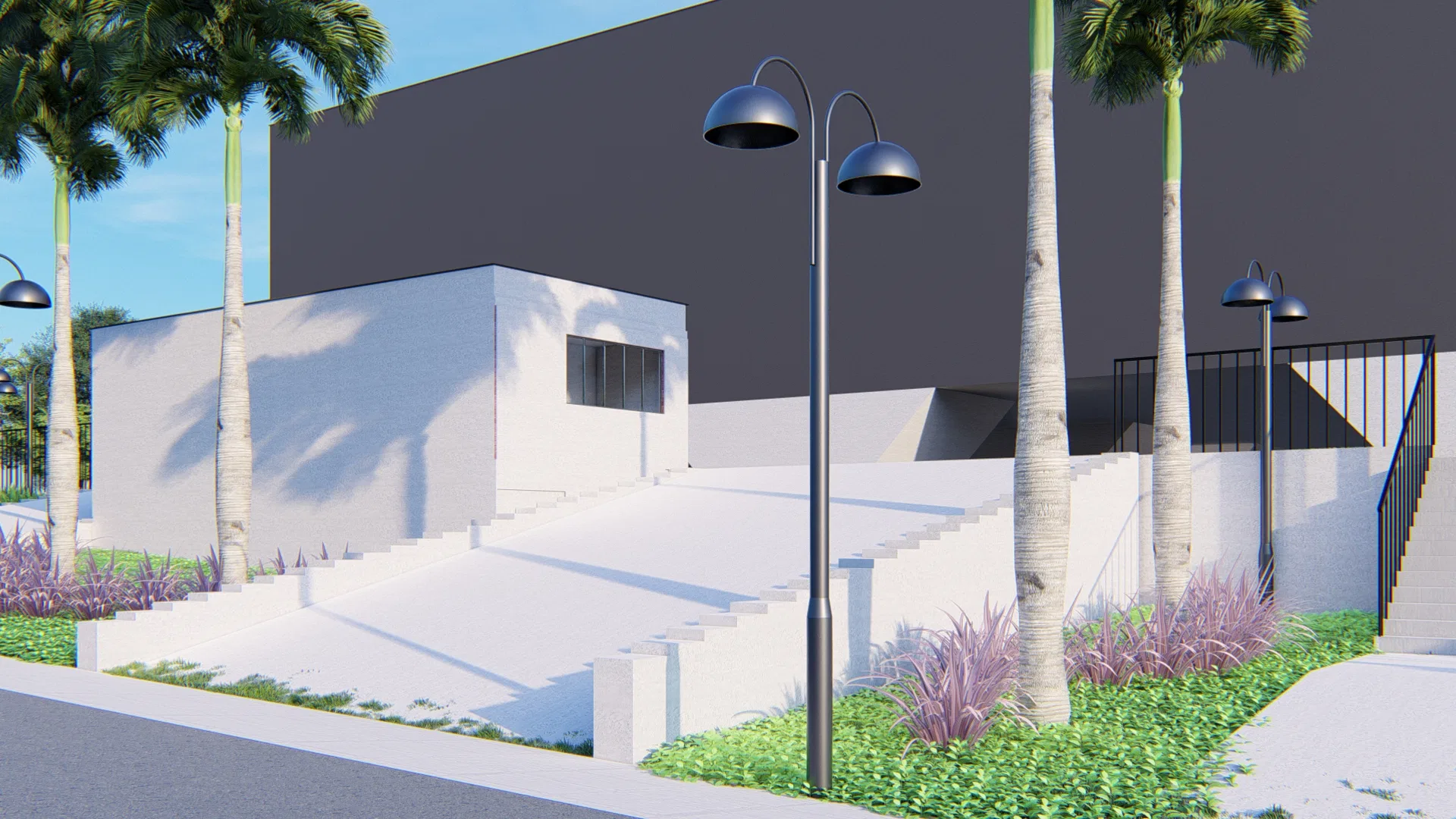 Entrance with a pale staircase framed by palm trees, street lamps, a white volume with a window and planting beds against the grey wall.