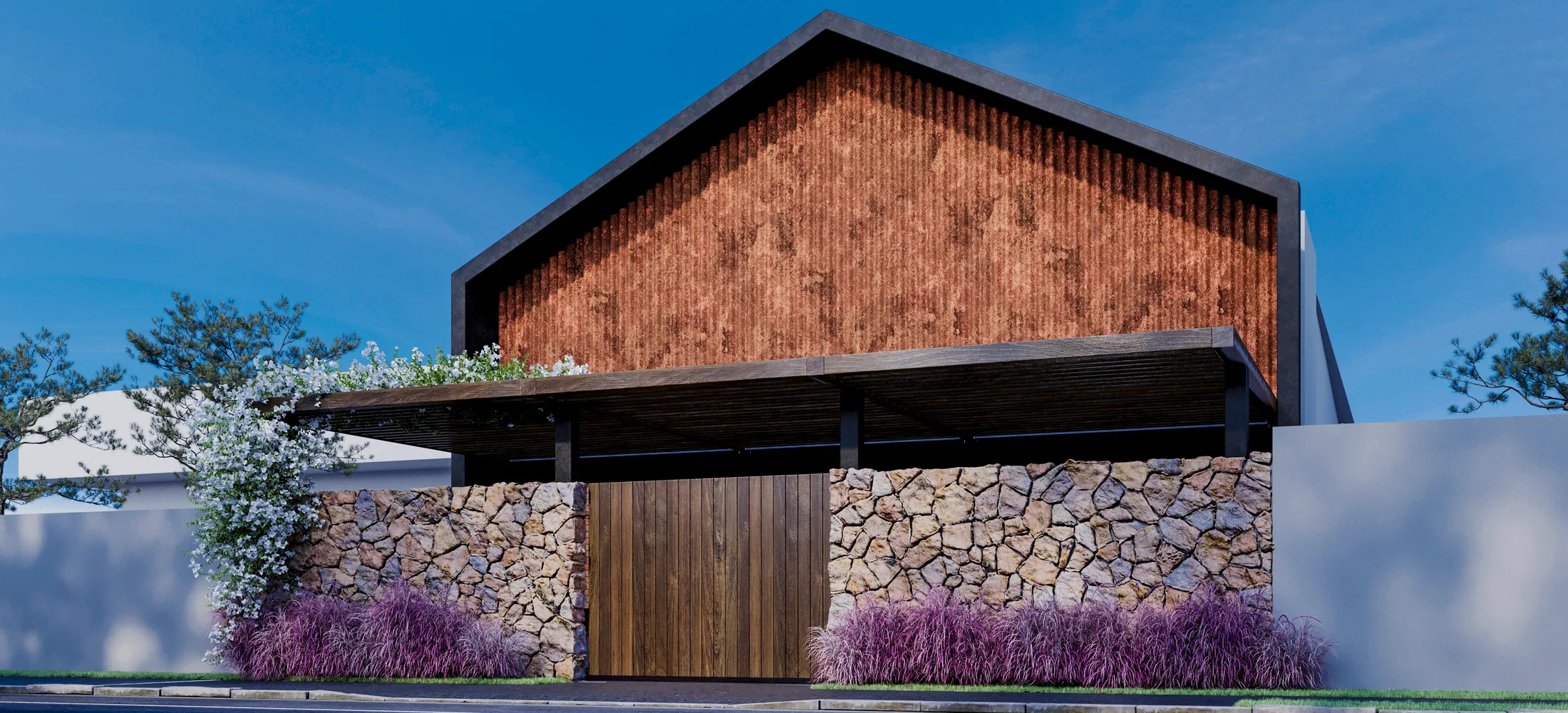 Angled view of the barn facade, highlighting the battened gable, the stone wall and flowering planting beside the wooden gate.