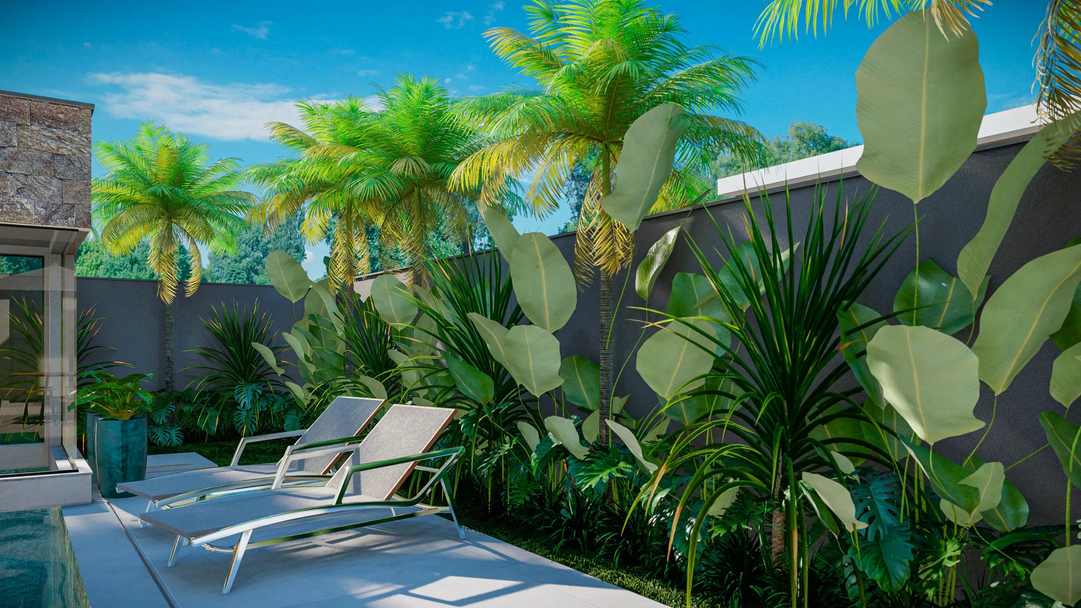 Pool terrace with loungers before a grouping of palms, dracaenas and broad-leaved foliage against the dark perimeter wall