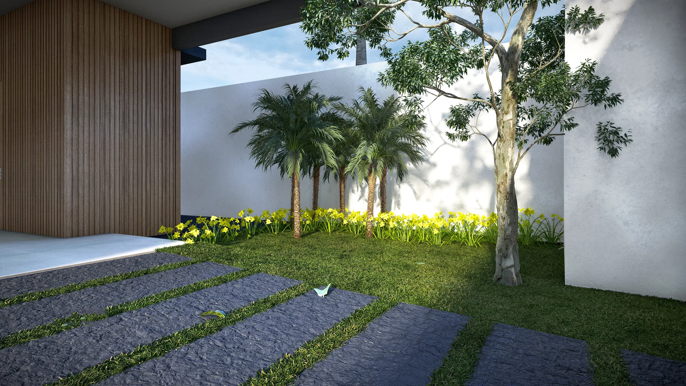 Internal courtyard with a wood-slat wall, a row of young palms and a slender tree, a bed of yellow flowers and dark stone pavers set across the lawn