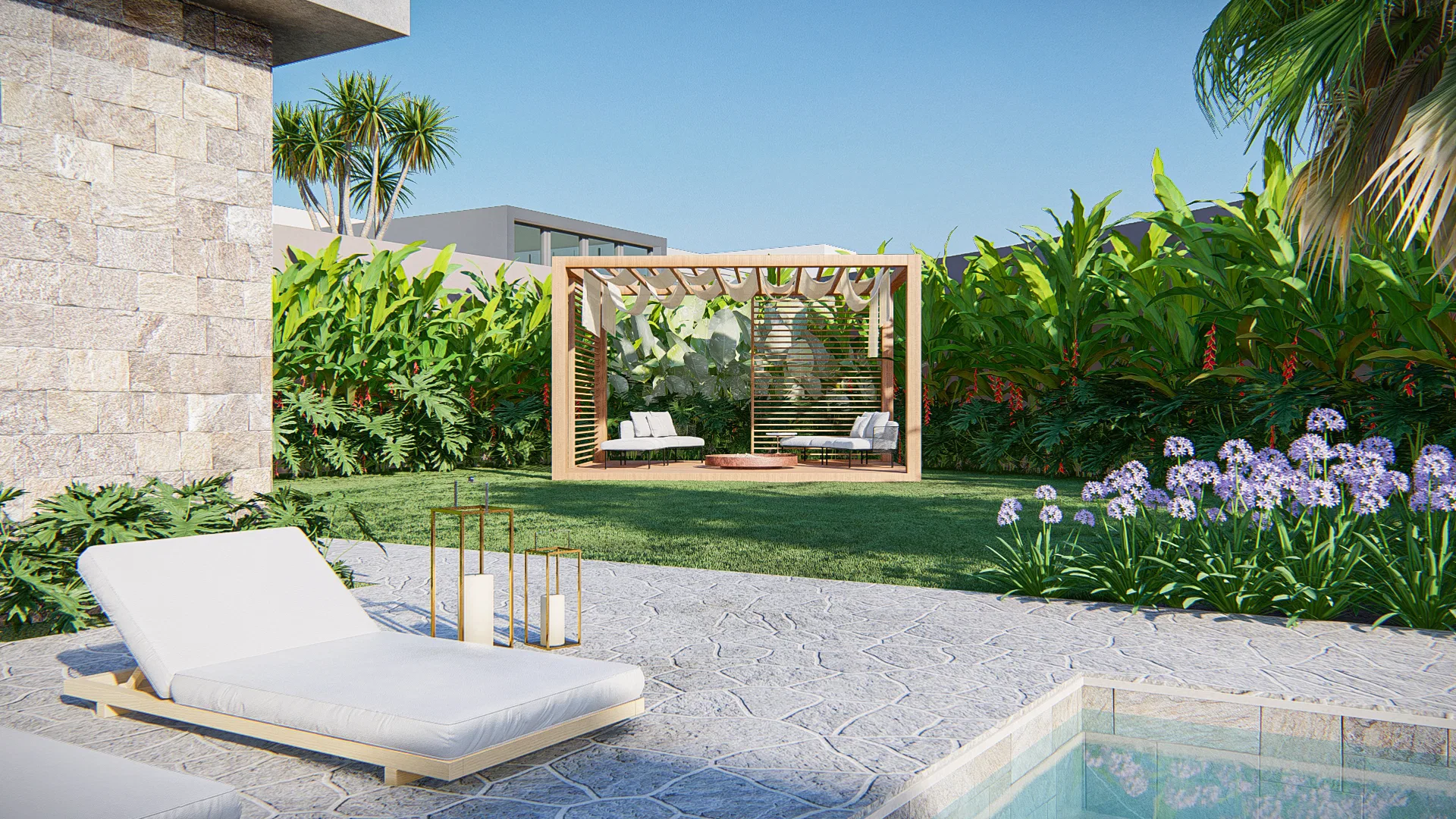Wooden pergola with white sofas on the lawn, a lounger and irregular stone paving beside a bed of agapanthus.