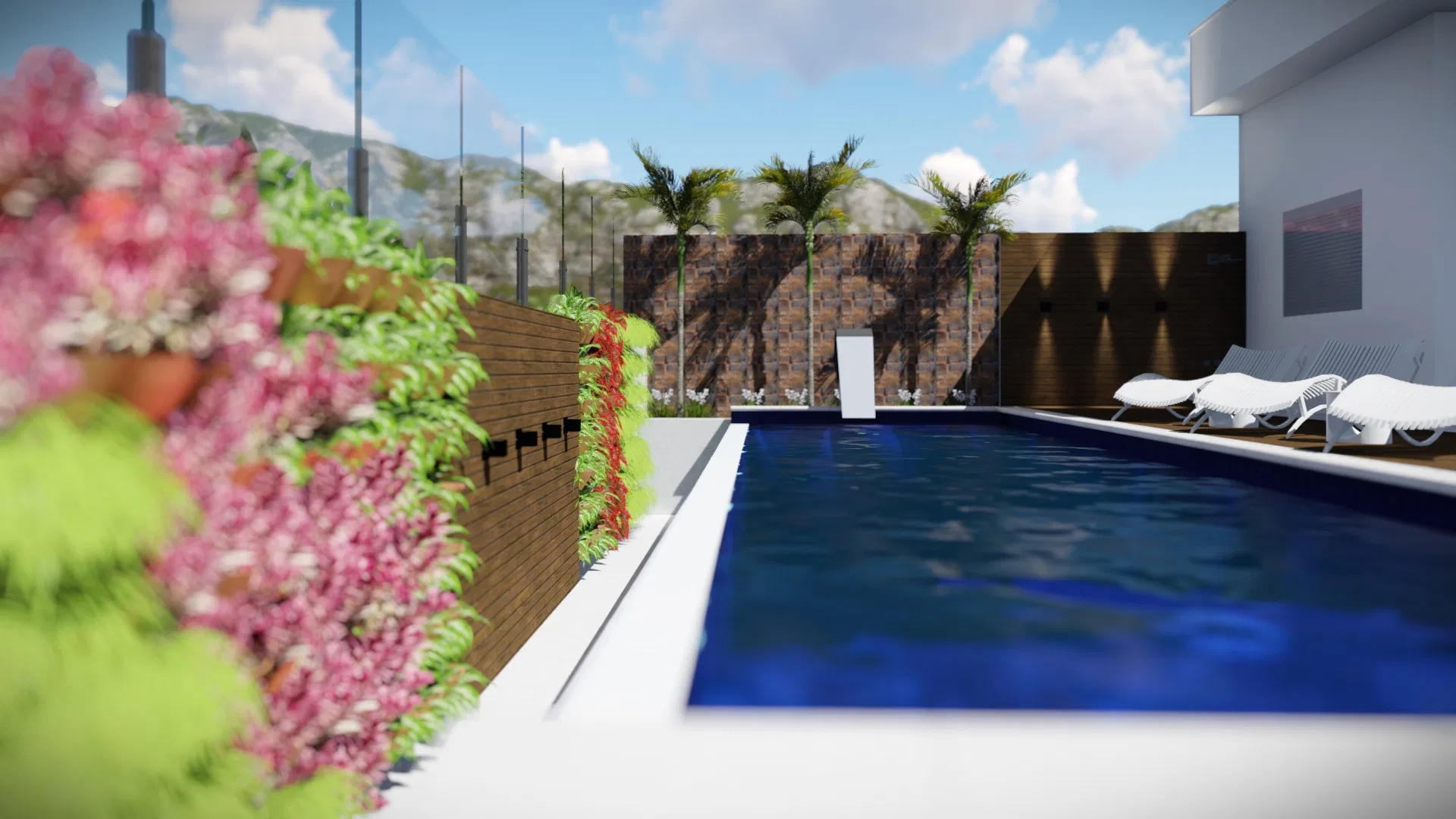 Lap pool edged by a flowering bougainvillea vertical garden and timber slats, with palms, loungers and hills in the distance