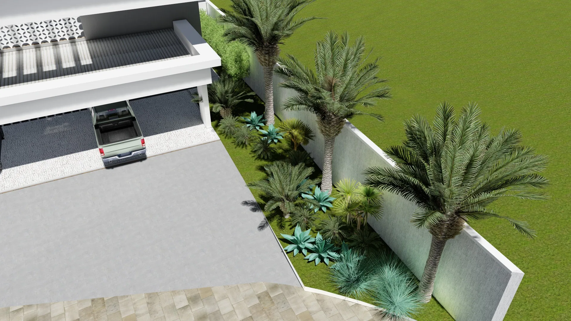Elevated view of the paved driveway with a pickup truck, a row of palms and agaves following the side wall and the lawn