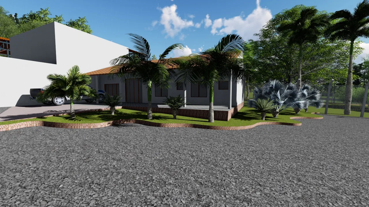 Low tile-roofed building with palms and a curving planting bed in front, edged by a broad gravel forecourt