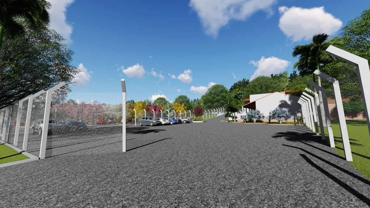 Internal access road lined with rhythmic white gateway posts, a railing, a tree-lined car park to the left and a tile-roofed building to the right