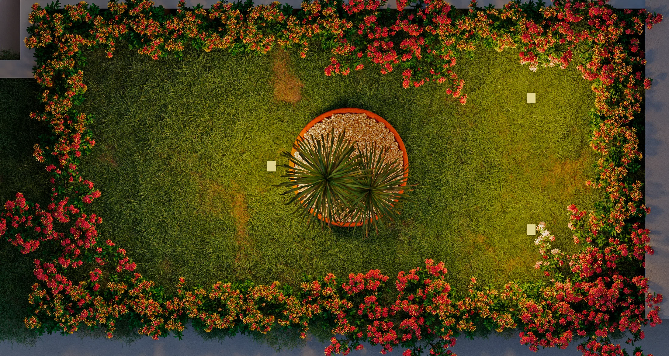 Top-down framing of a lawn edged by red flowering shrubs, with a central circular bed of fan-leaved foliage over gravel.
