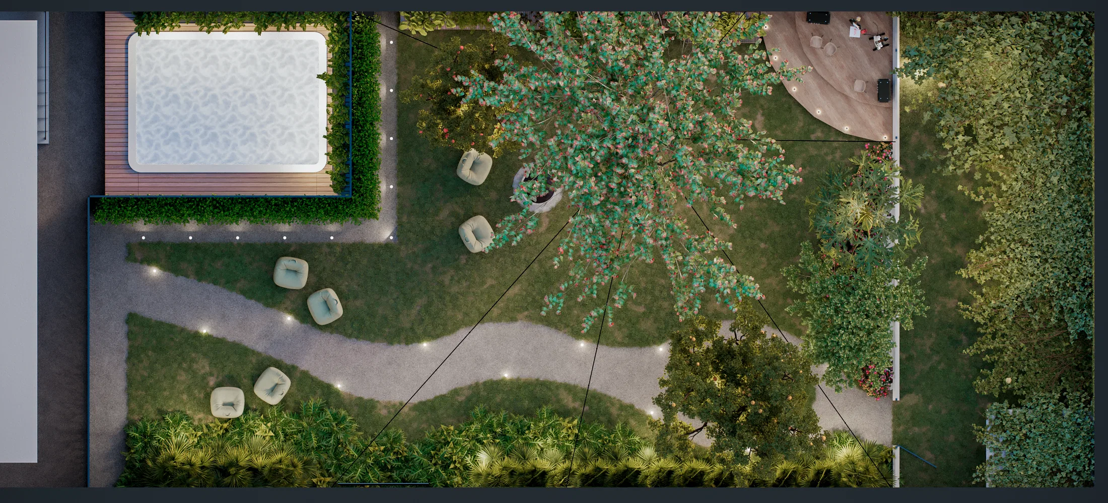 Aerial view of the backyard at nightfall, with a spa on a wooden deck, a lit winding path, a central tree canopy and dense planted borders.