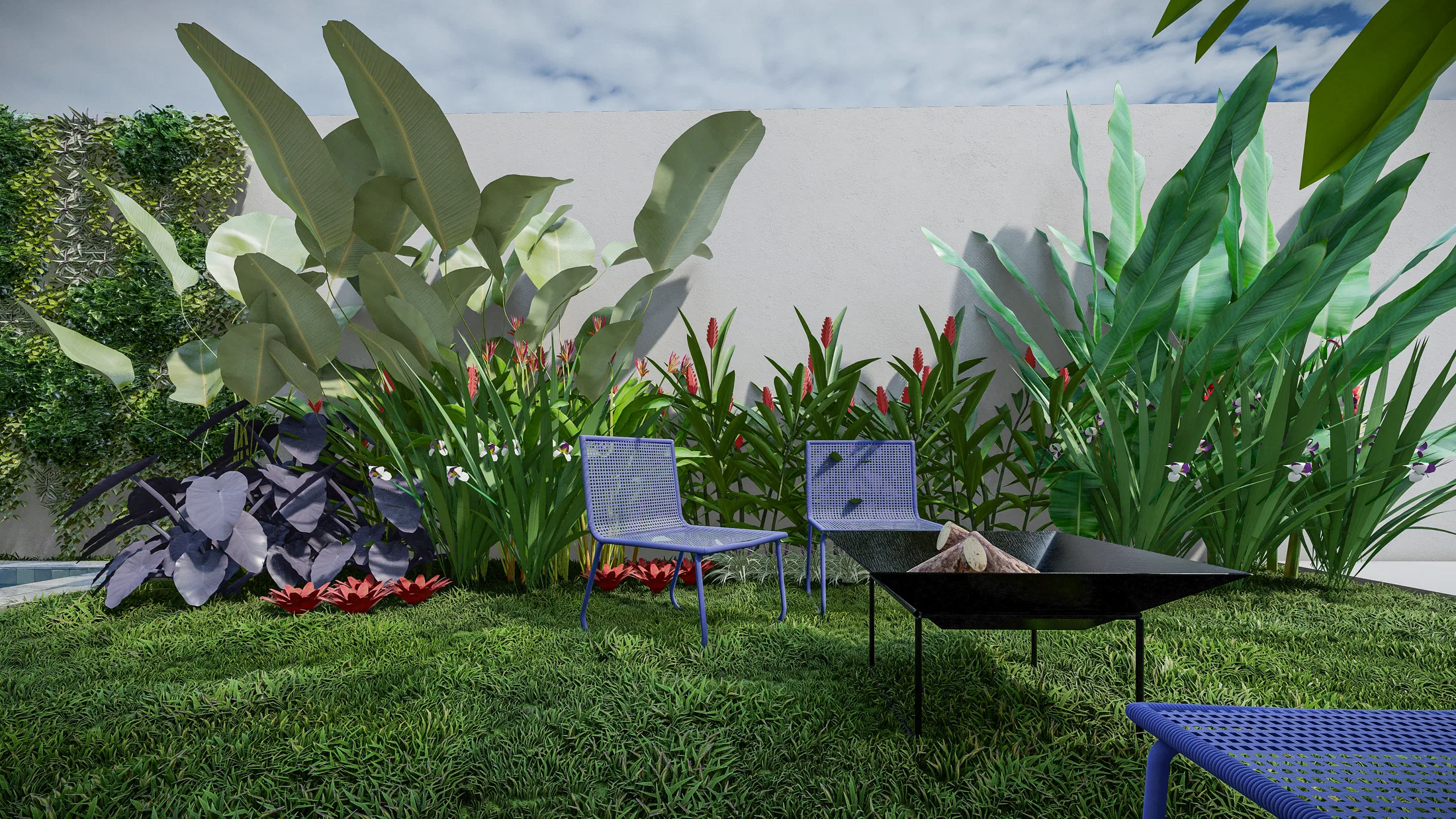 Bed of red heliconias and large-leaved foliage bordering blue chairs and a fire pit table on the lawn
