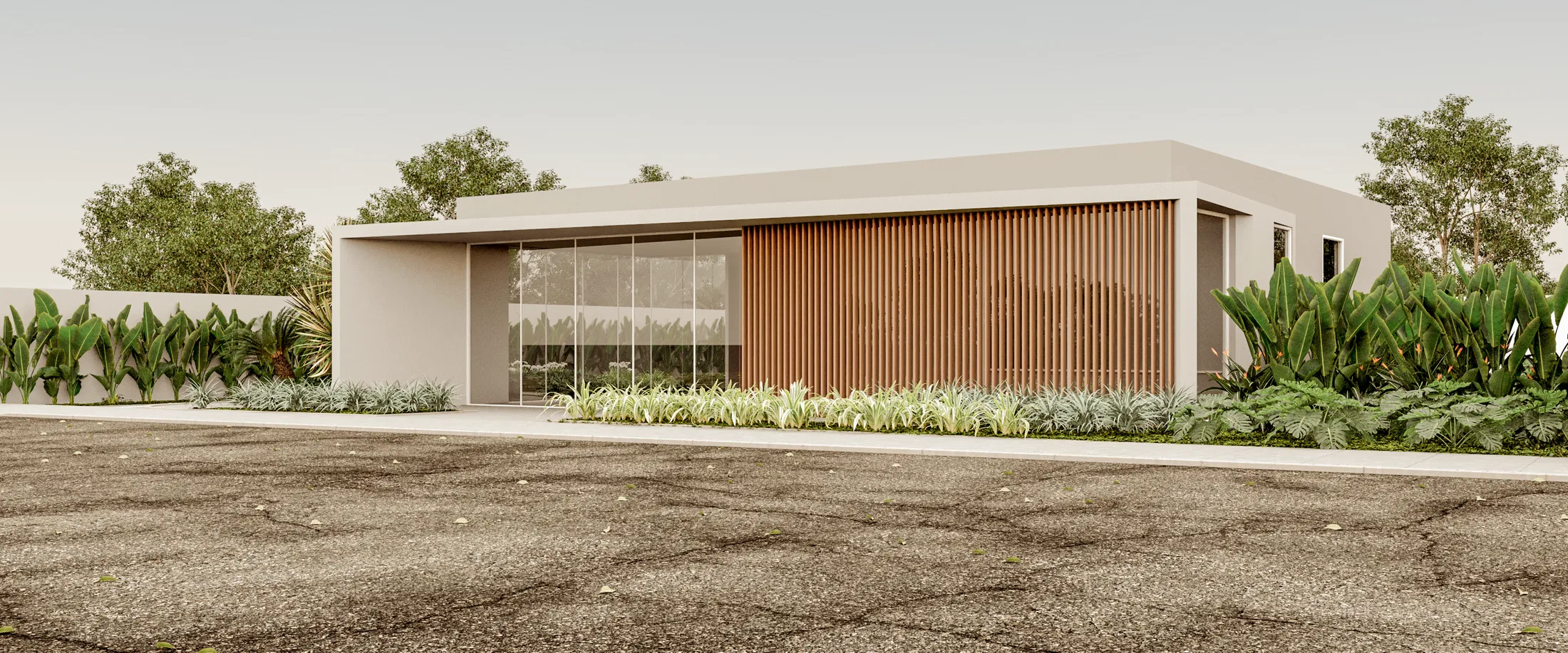 Facade view from another angle, showing the wood-slat volume beside the glass panels and permeable paving at the entrance